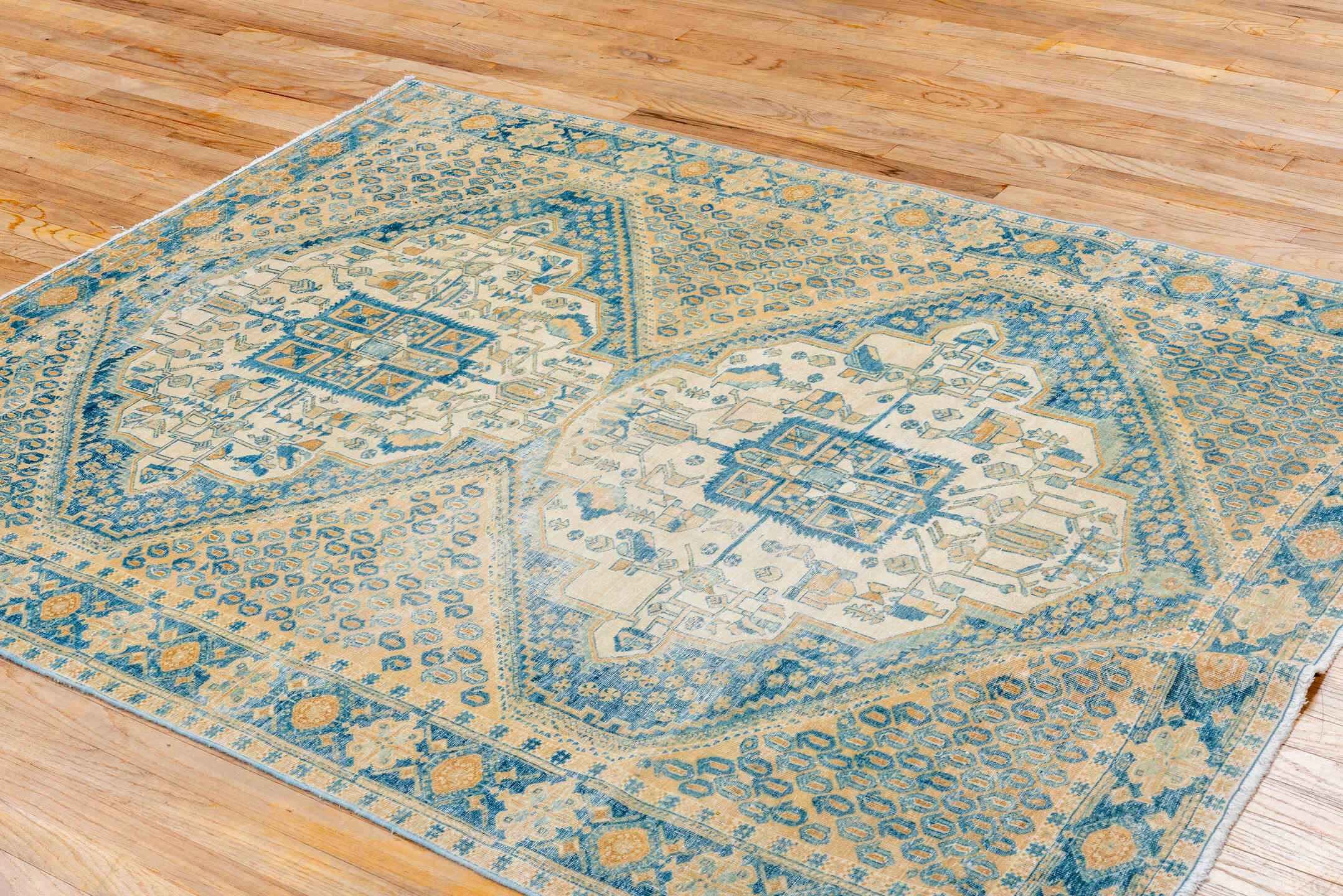 5' x 6' one-of-a-kind handmade antique Afshar rug. Color palette: ivory, sky blue, sand, camel, beige, light blue