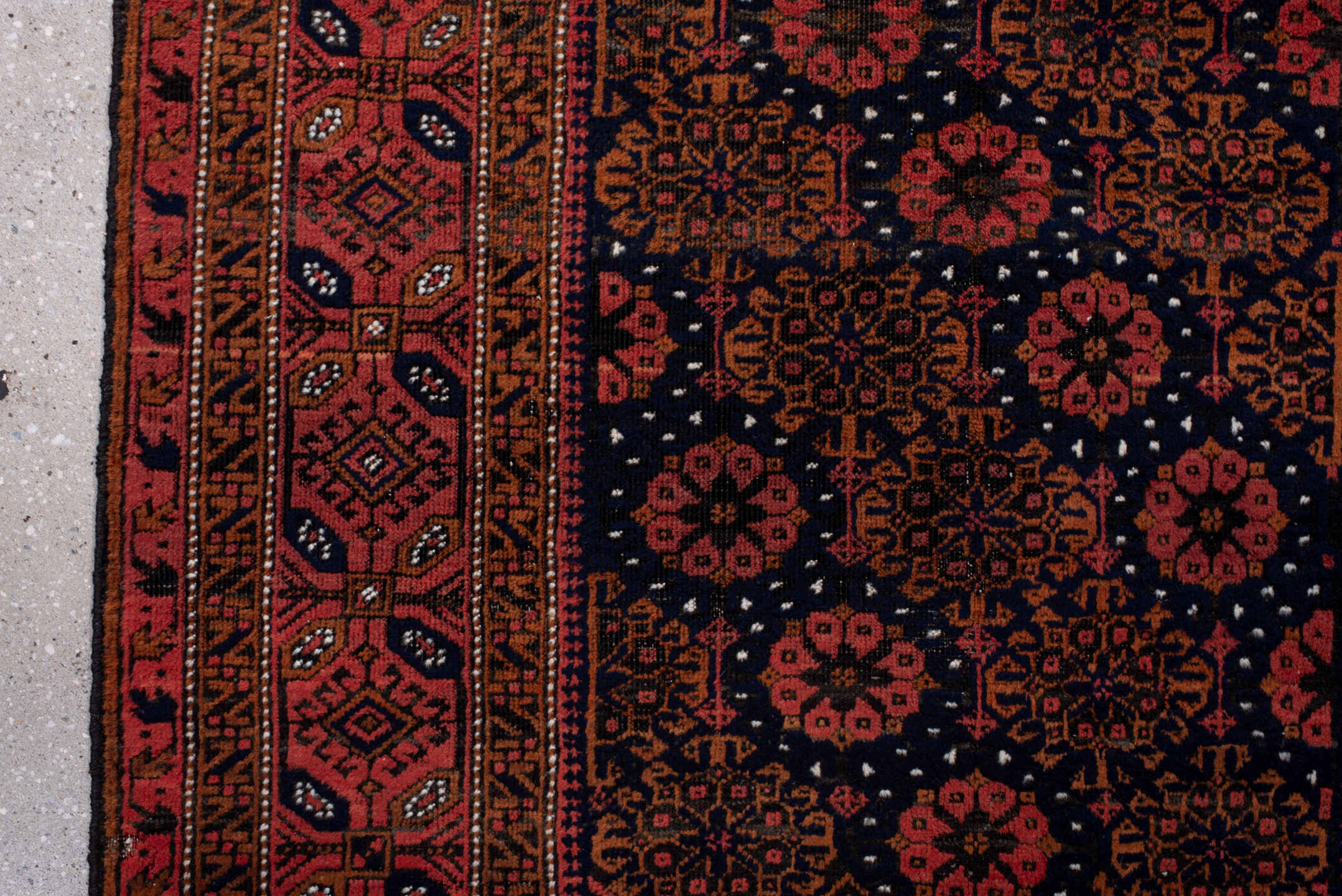3' x 7' one-of-a-kind handmade antique Belouch rug. Color palette: rust, navy, terracotta, burgundy, camel, ivory, charcoal