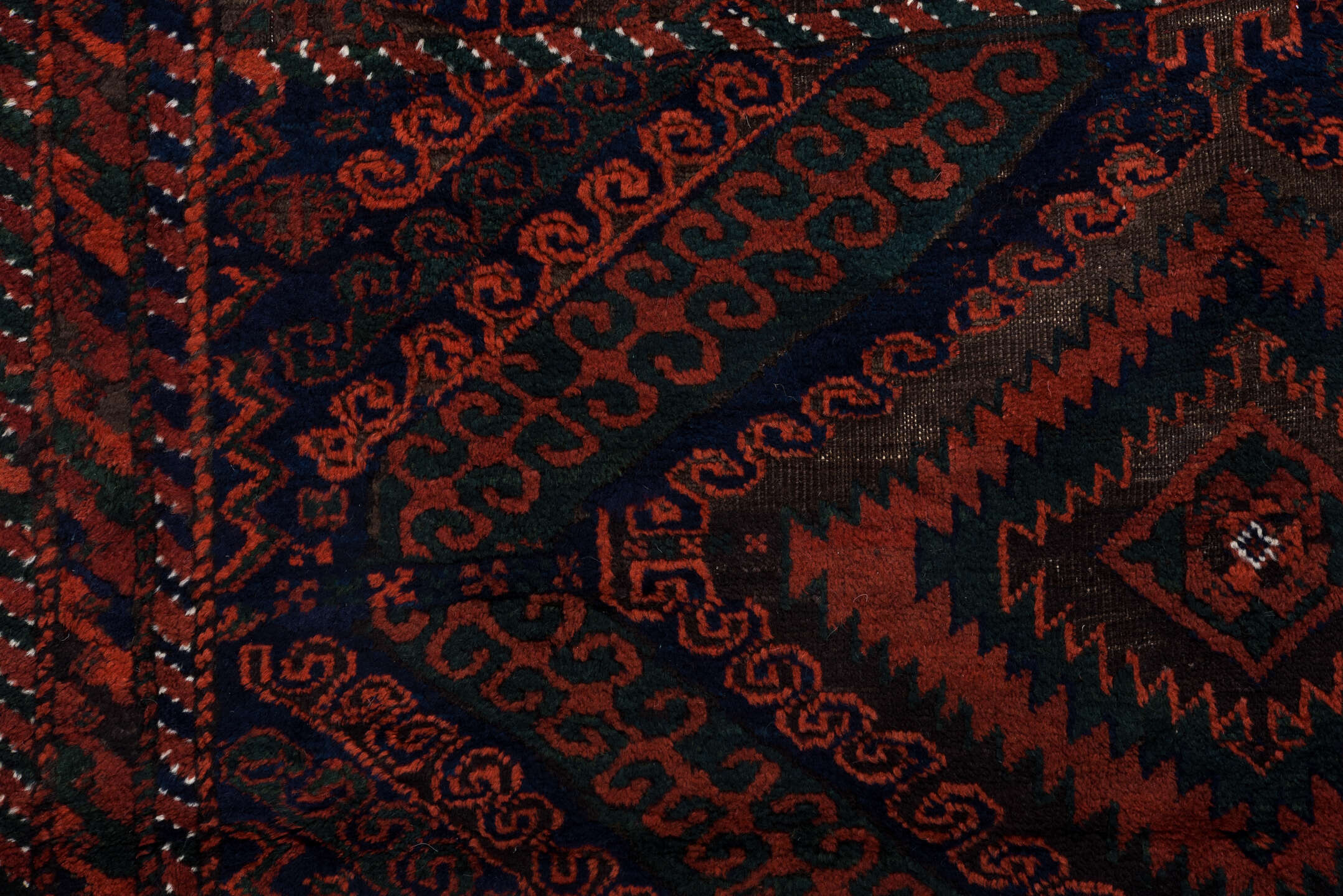 3' x 8' one-of-a-kind handmade vintage Belouch runner rug. Color palette: crimson, black, burgundy, ivory, charcoal, red