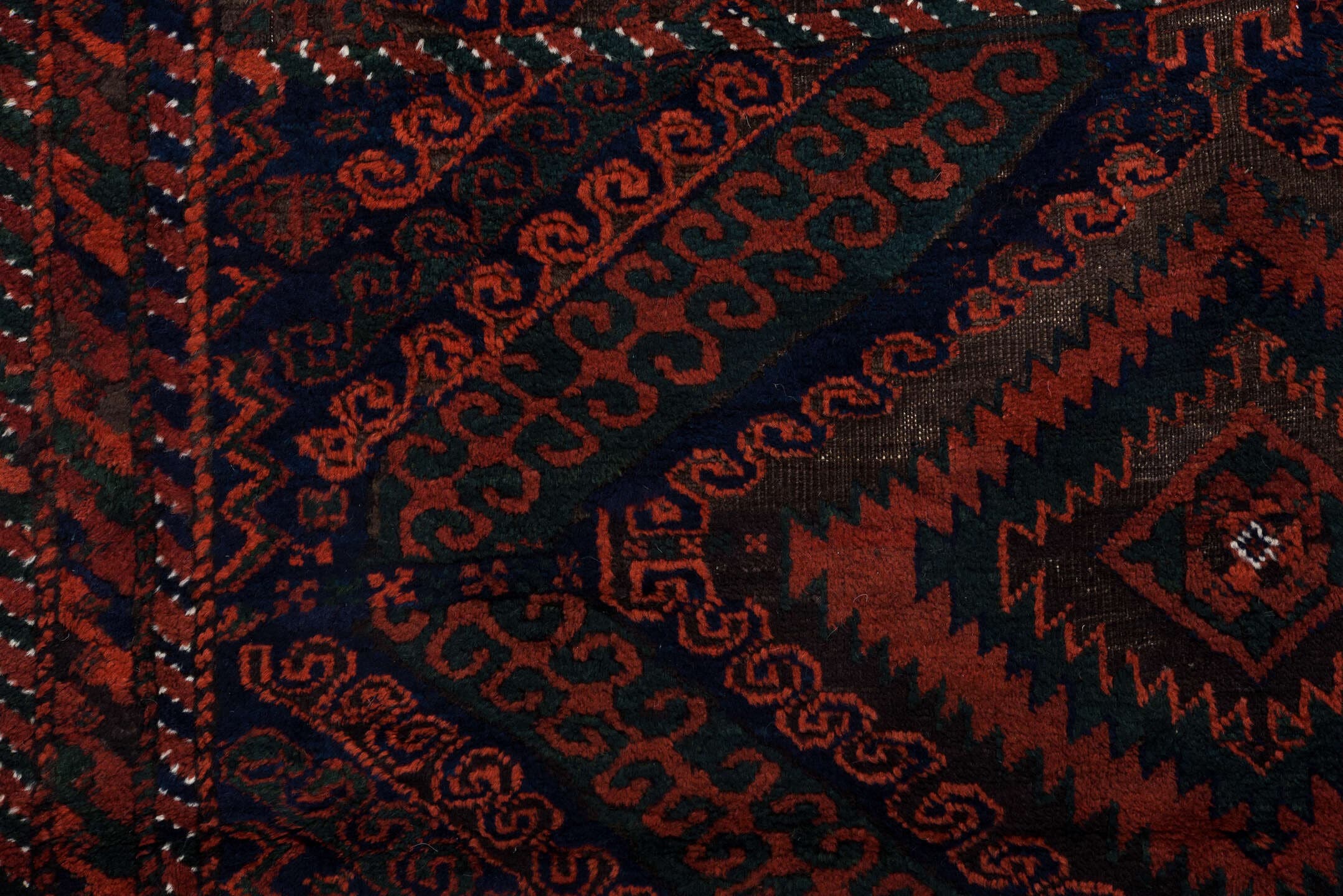 3' x 8' one-of-a-kind handmade vintage Belouch runner rug. Color palette: crimson, black, burgundy, ivory, charcoal, red