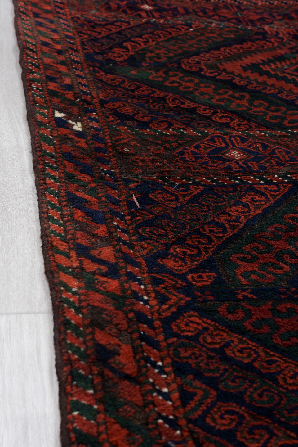 3' x 8' one-of-a-kind handmade vintage Belouch runner rug. Color palette: crimson, black, burgundy, ivory, charcoal, red