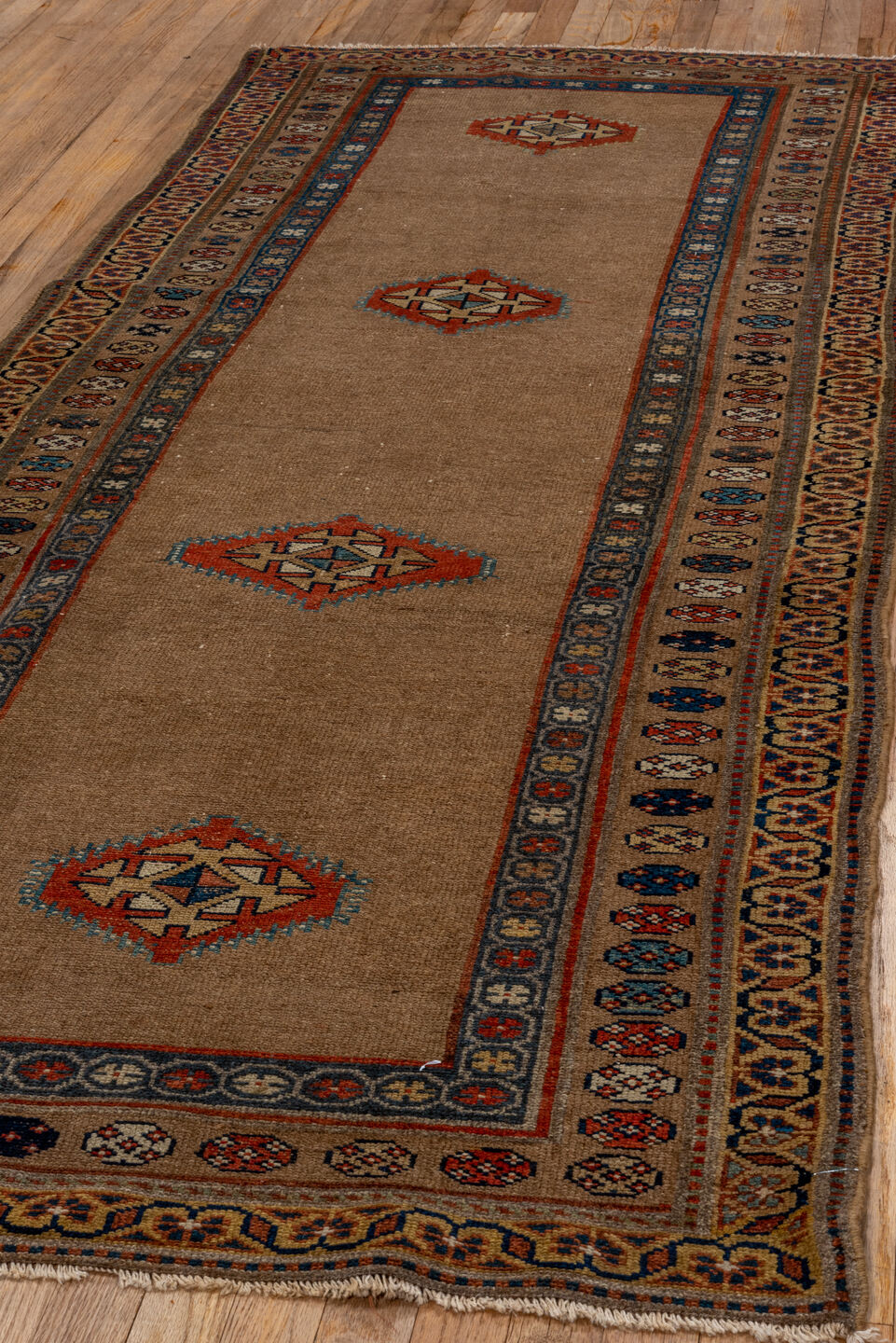 3' x 8' one-of-a-kind handmade vintage Sarab runner rug. Color palette: black, blue, brown, gray, pink, red