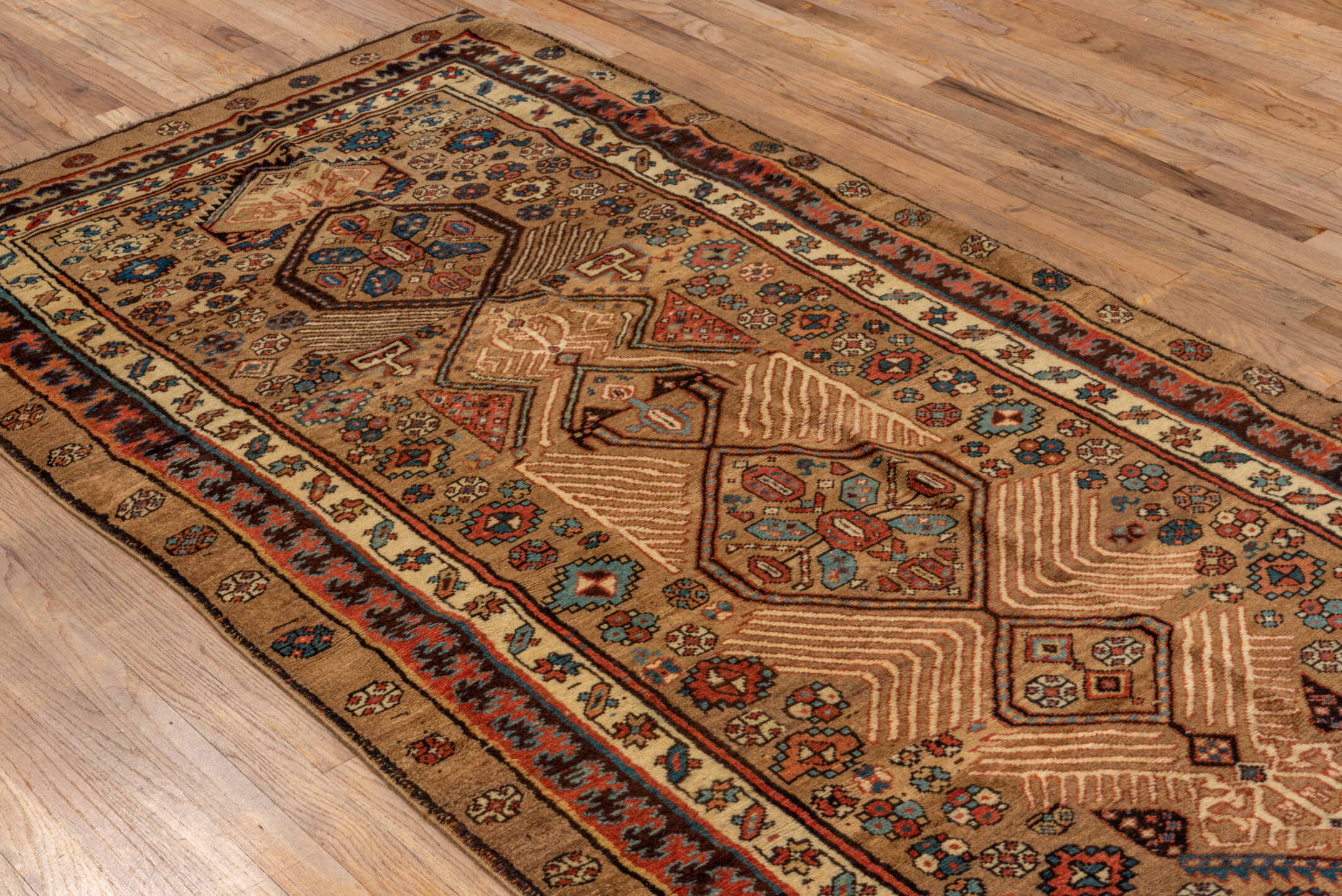 4' x 8' one-of-a-kind handmade antique Sarab runner rug. Color palette: camel, taupe, ivory, rust, indigo, brown, slate