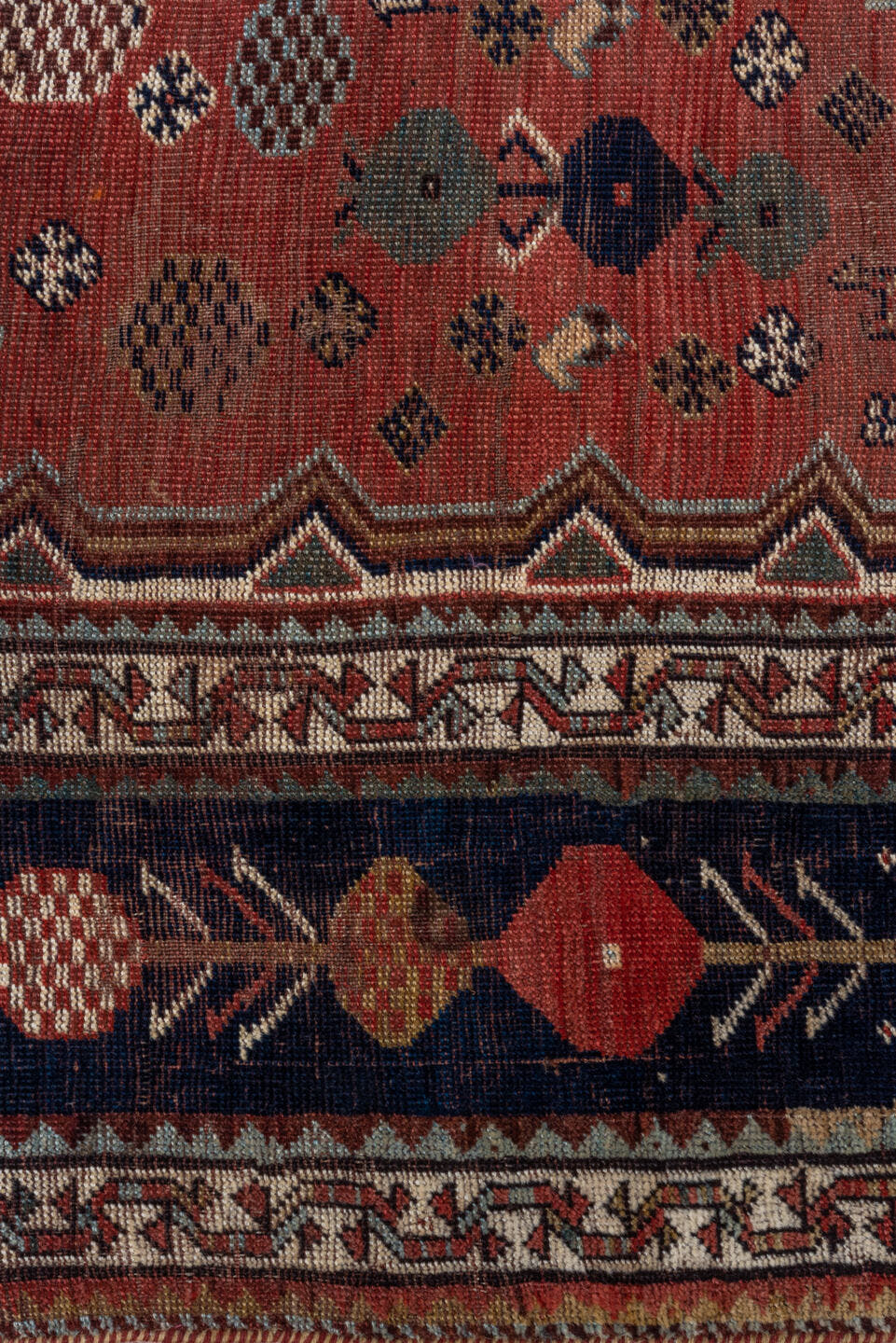 5' x 8' one-of-a-kind handmade antique Qashqai medium size rug. Color palette: rust, indigo, ivory, slate, terra cotta