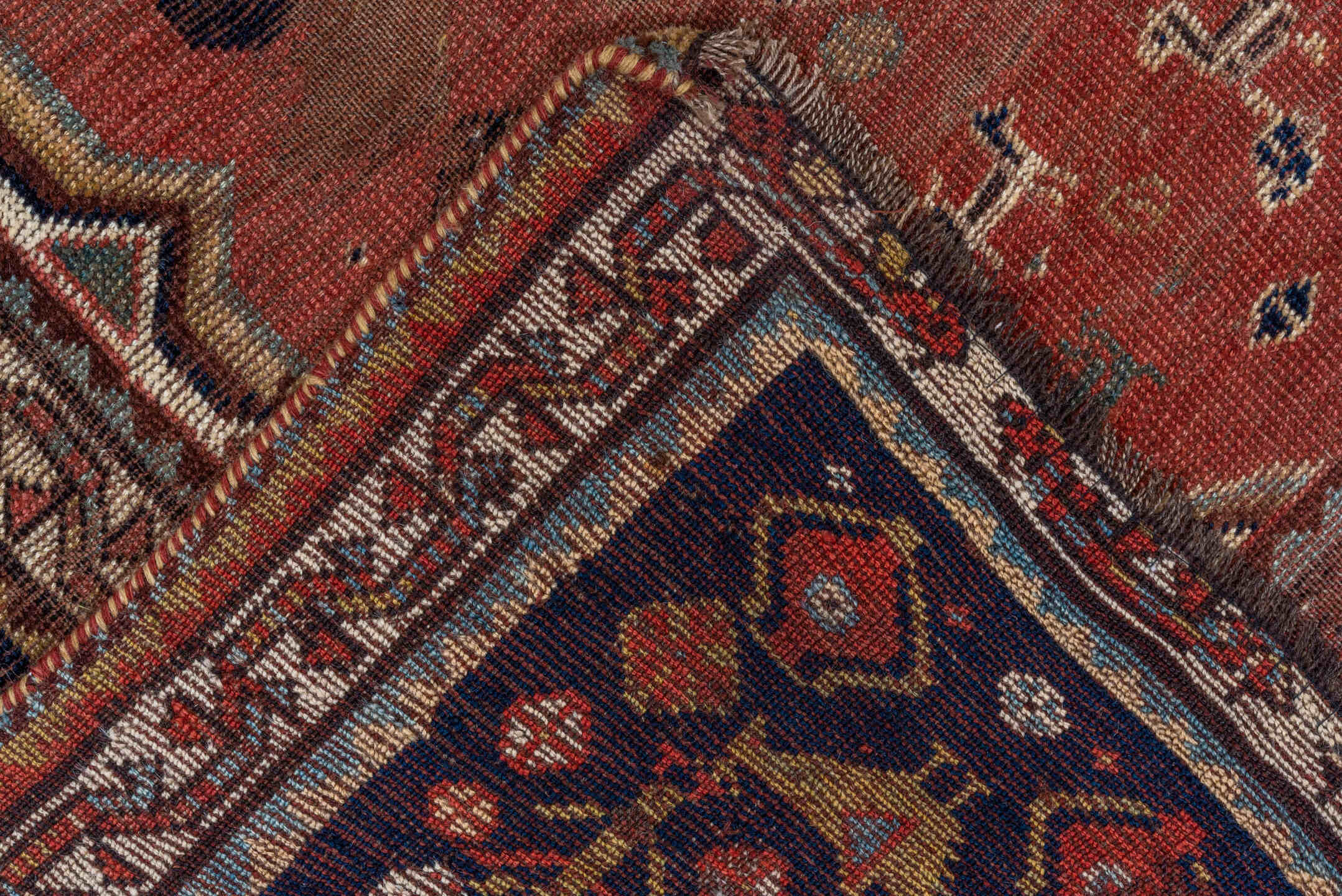 5' x 8' one-of-a-kind handmade antique Qashqai medium size rug. Color palette: rust, indigo, ivory, slate, terra cotta