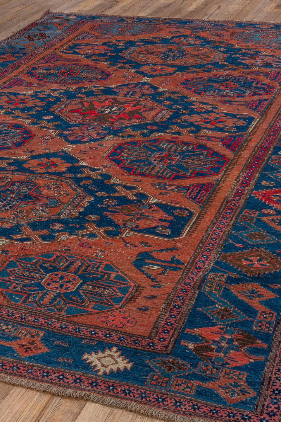 6' x 9' one-of-a-kind handmade antique Sumak medium size rug. Color palette: terra cotta, indigo, sky blue, rust, crimson