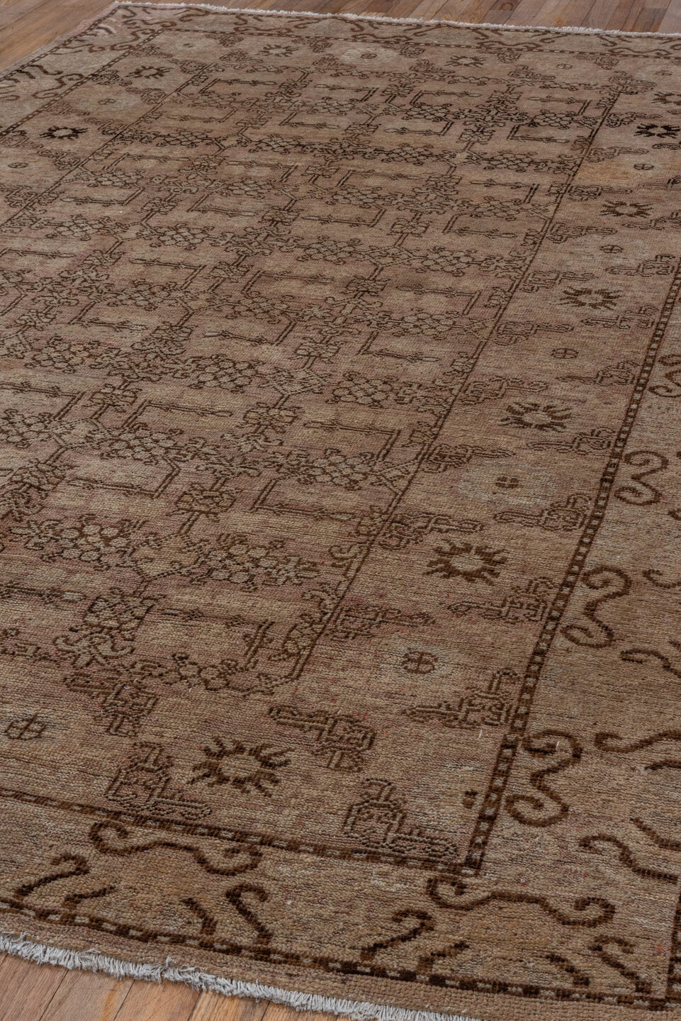 6' x 9' one-of-a-kind handmade antique Khotan medium size rug. Color palette: beige, taupe, brown, camel, ivory, gray