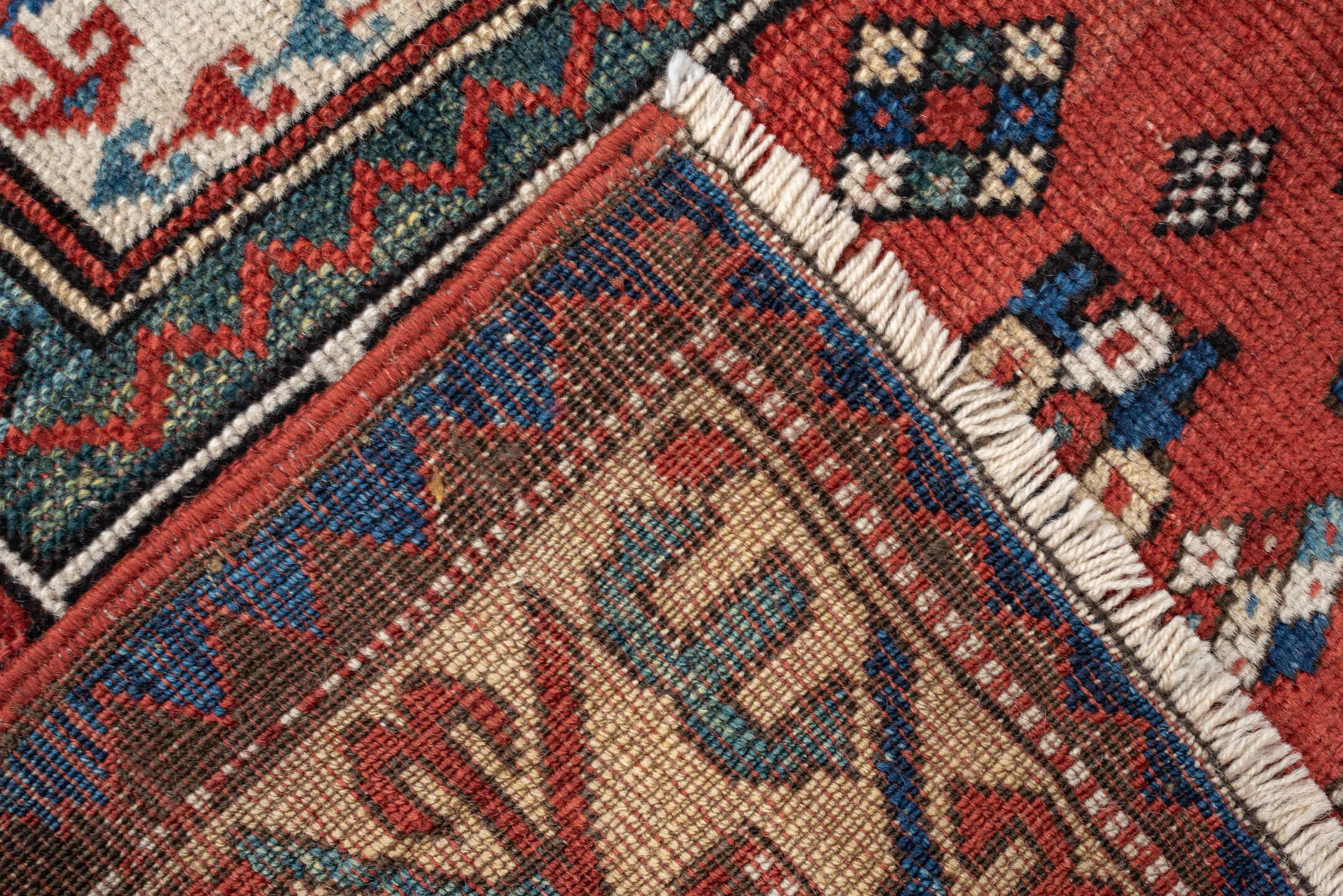 3' x 5' one-of-a-kind handmade antique Kazak small size rug. Color palette: terracotta, ivory, indigo, rust, sky_blue, navy