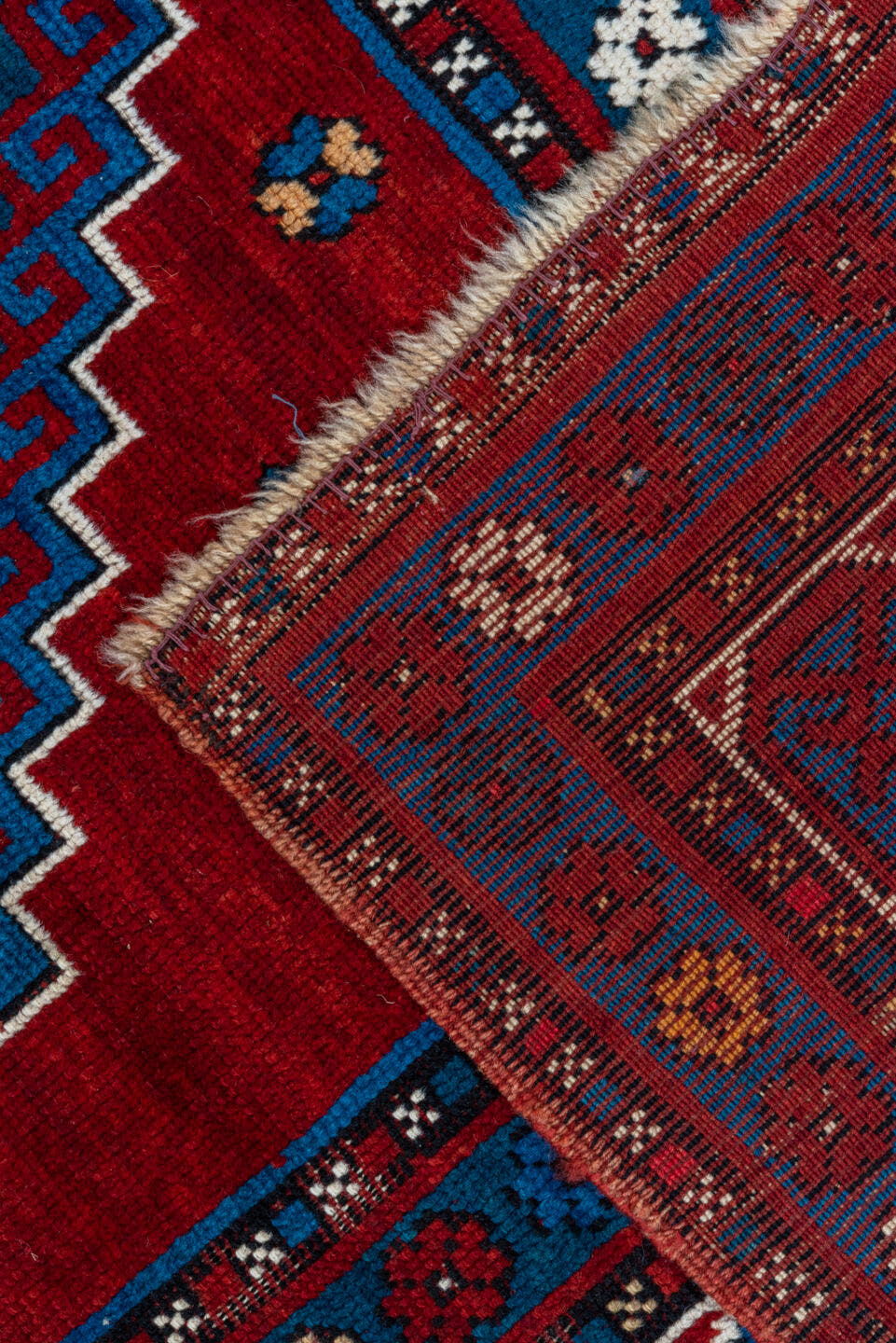 4' x 10' one-of-a-kind handmade antique Kazak runner rug. Color palette: red, navy, sky blue, ivory, crimson, charcoal, rose