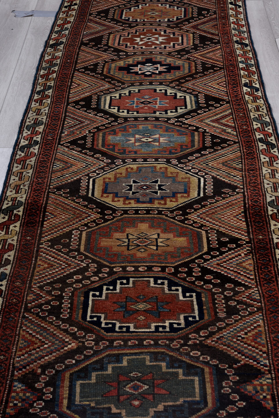 3' x 10' one-of-a-kind handmade vintage NW Persian runner rug. Color palette: black, blue, brown, charcoal, gray, indian red