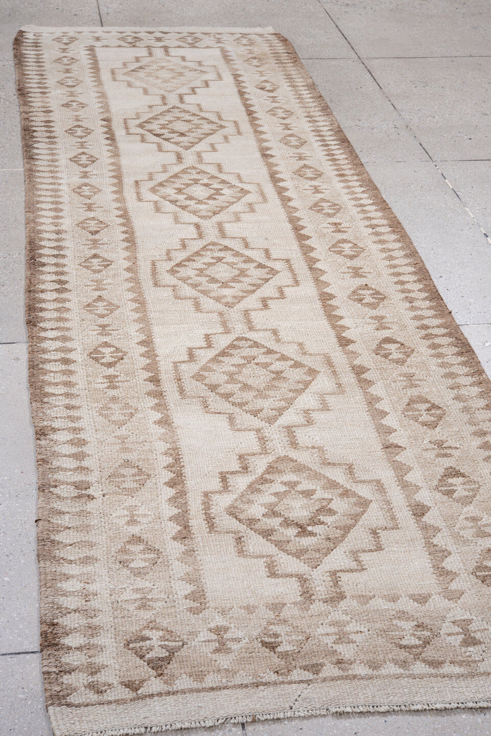 3' x 11' one-of-a-kind handmade antique Kilim runner rug. Color palette: ivory, taupe, beige, sand, gray