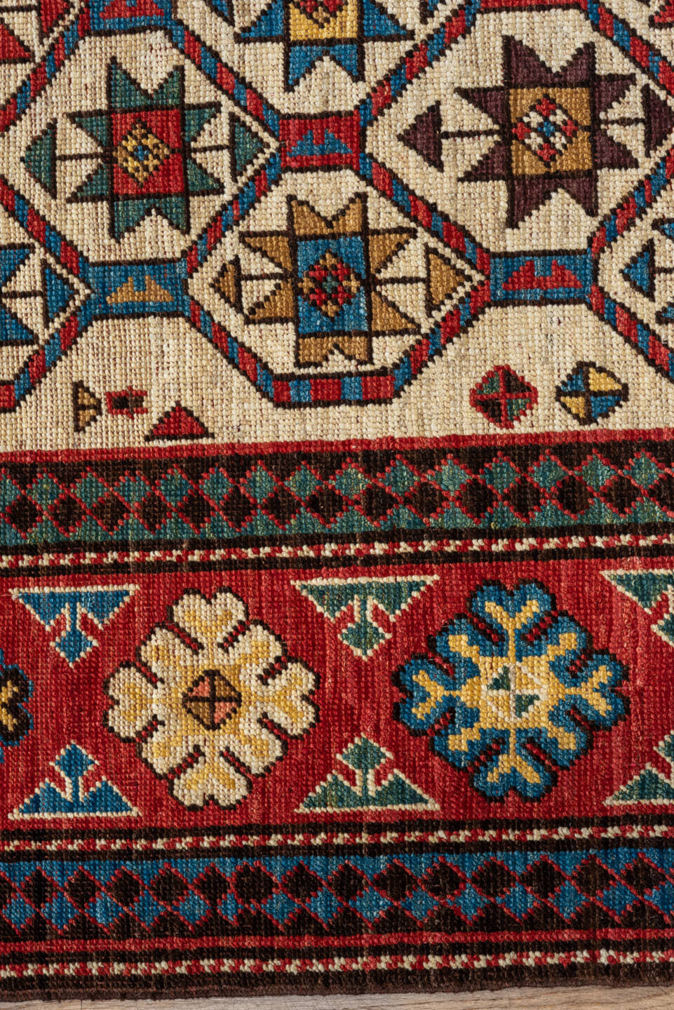 4' x 7' one-of-a-kind handmade vintage Kazak rug. Color palette: red, ivory, sky blue, navy, camel, brown, black, sage