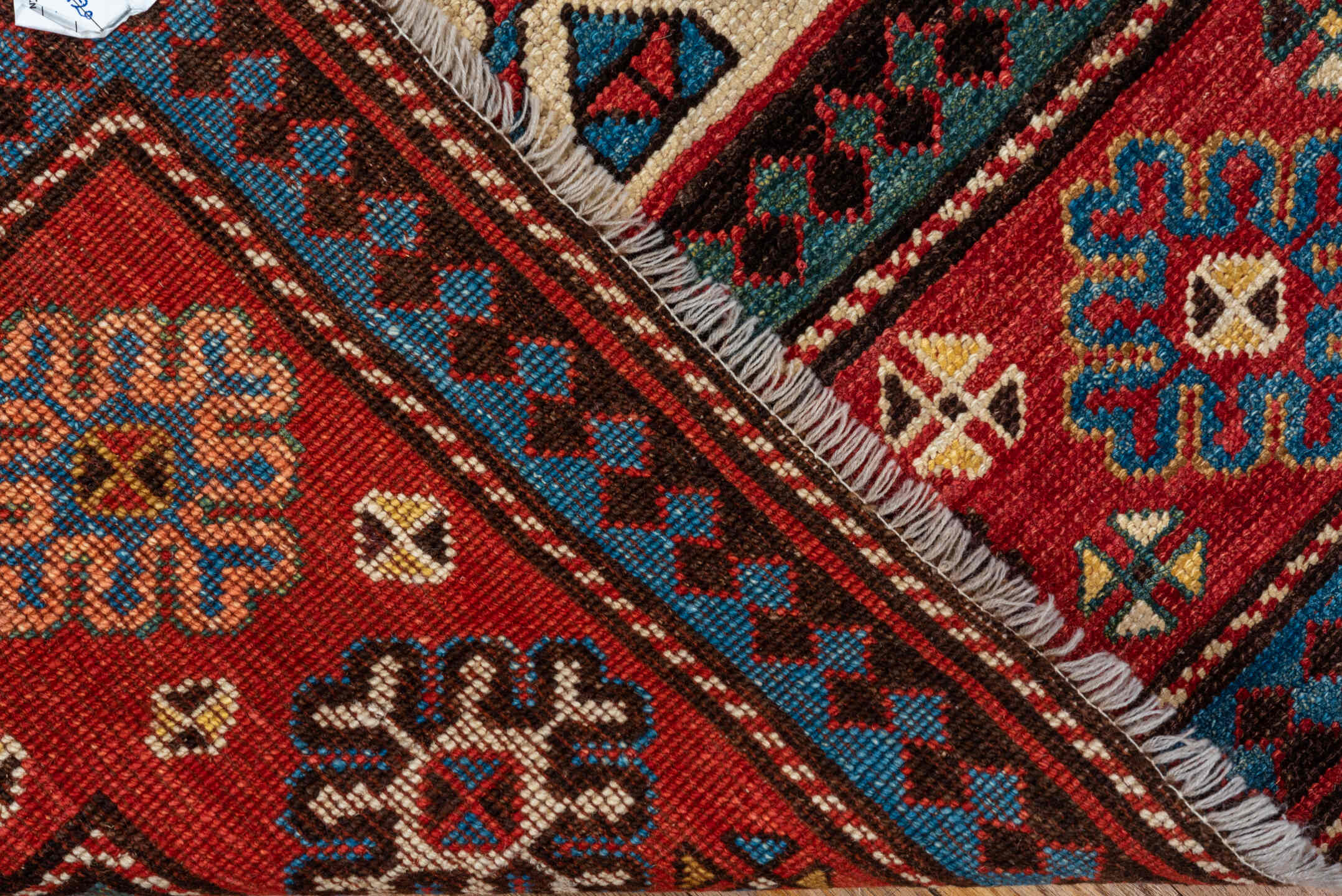 4' x 7' one-of-a-kind handmade vintage Kazak rug. Color palette: red, ivory, sky blue, navy, camel, brown, black, sage