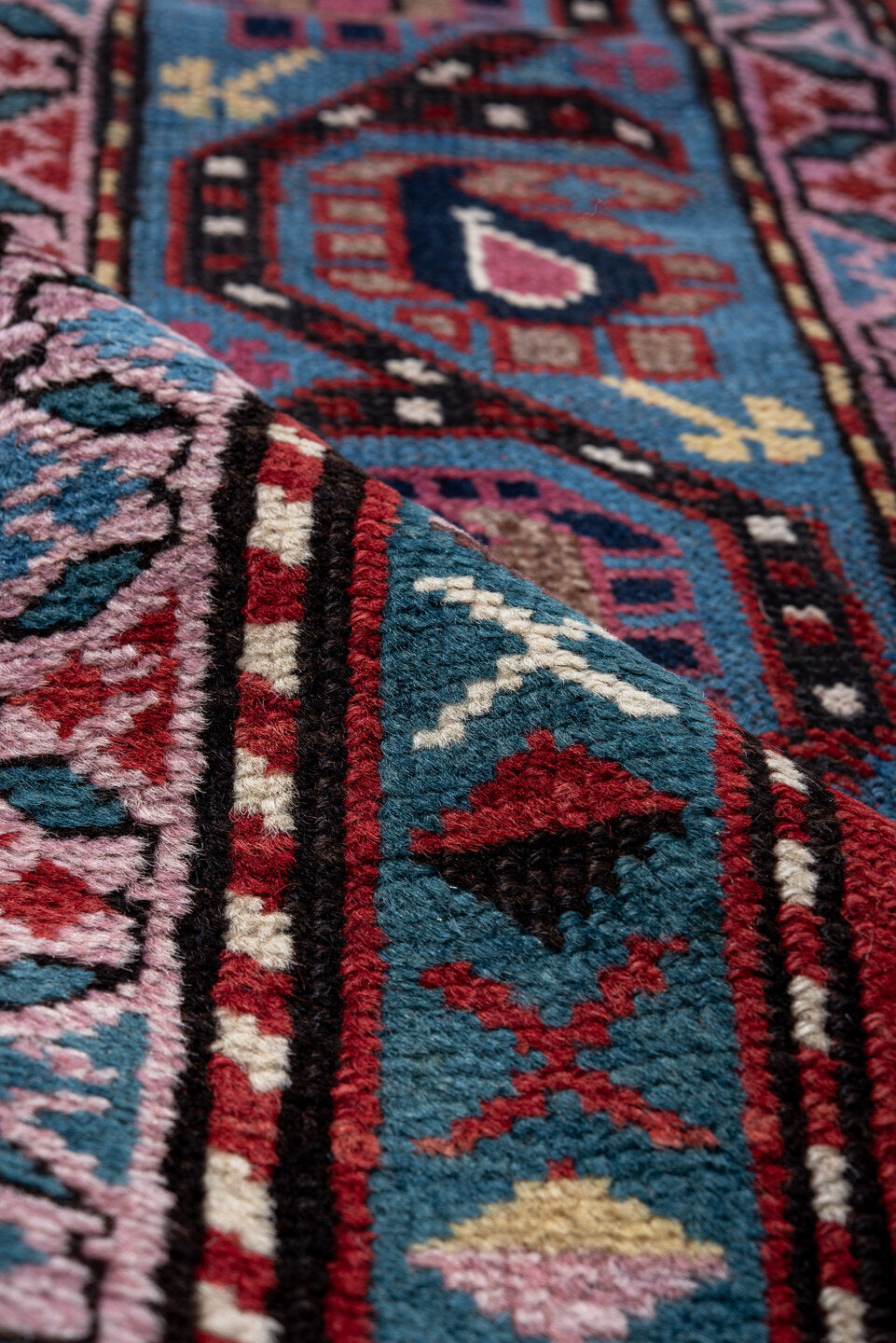 3' x 11' one-of-a-kind handmade vintage Caucasian runner rug. Color palette: black, blue, brown, fiord, gray, indian red