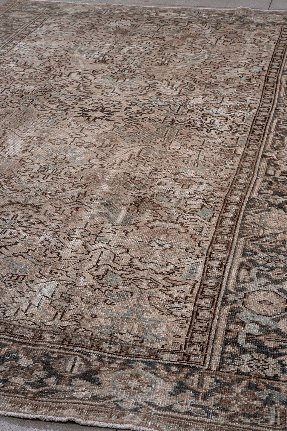7' x 10' one-of-a-kind handmade antique Heriz large size rug. Color palette: taupe, brown, ivory, charcoal, sage, camel