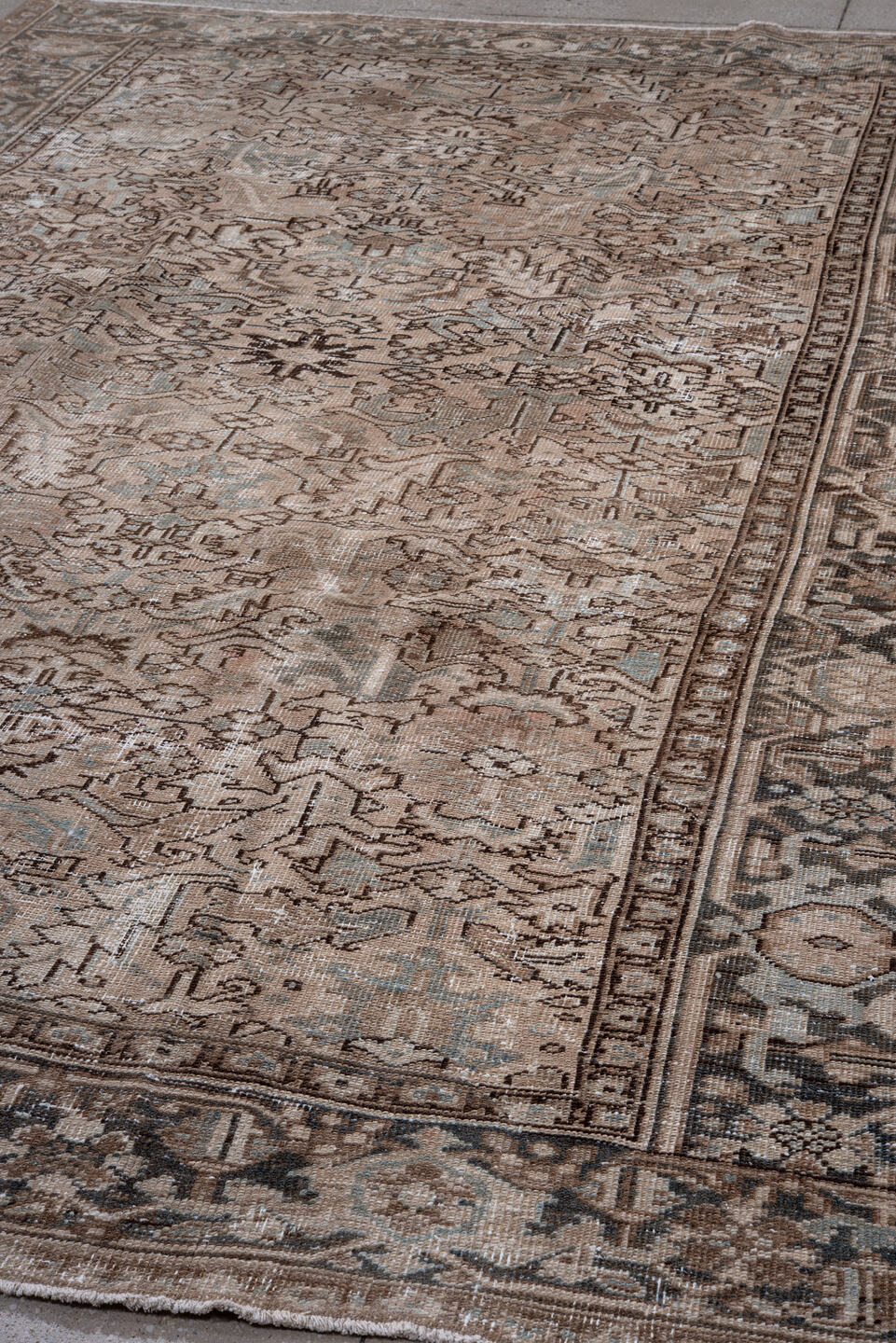 7' x 10' one-of-a-kind handmade antique Heriz large size rug. Color palette: taupe, brown, ivory, charcoal, sage, camel