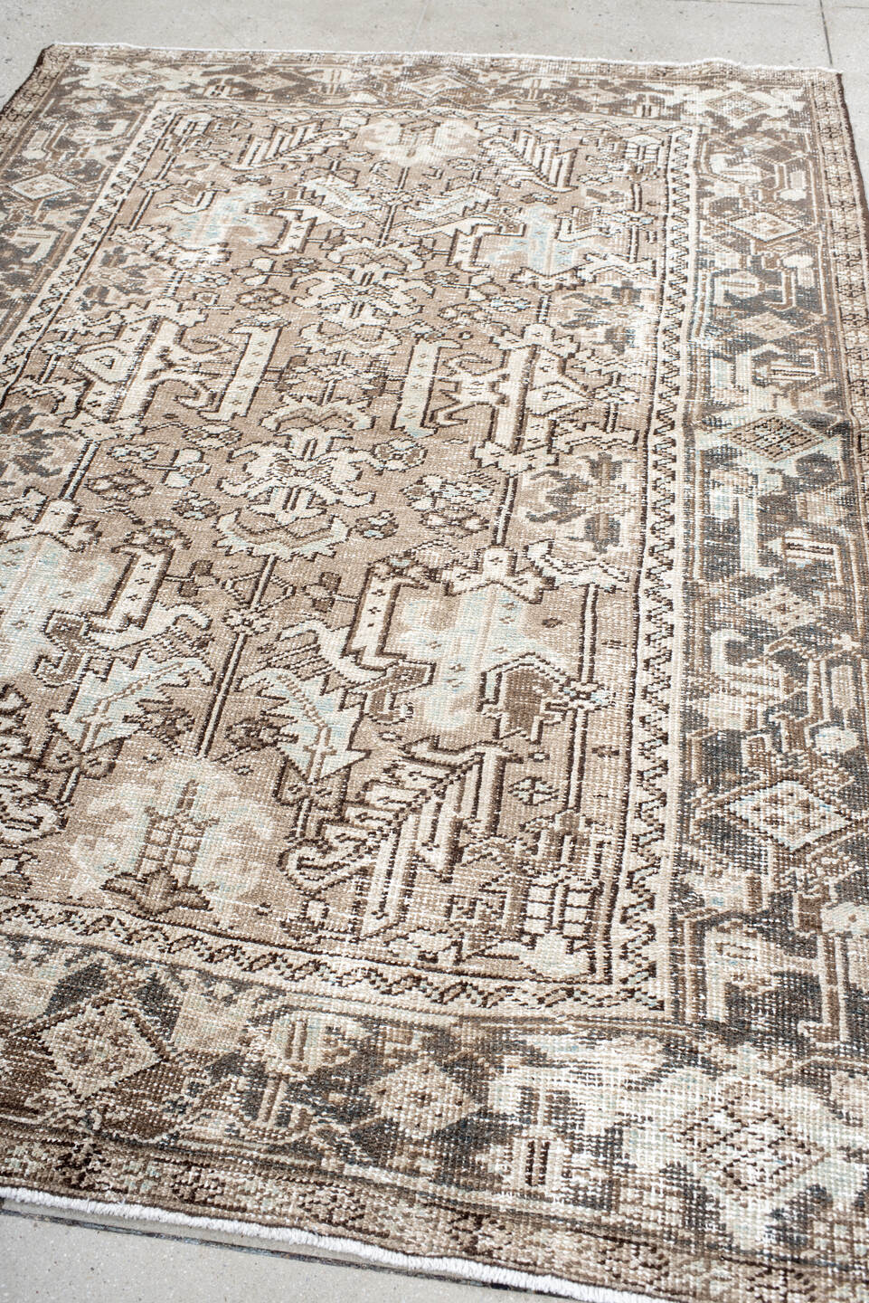 5' x 8' one-of-a-kind handmade antique Heriz medium size rug. Color palette: taupe, ivory, charcoal, brown, pale blue, cream