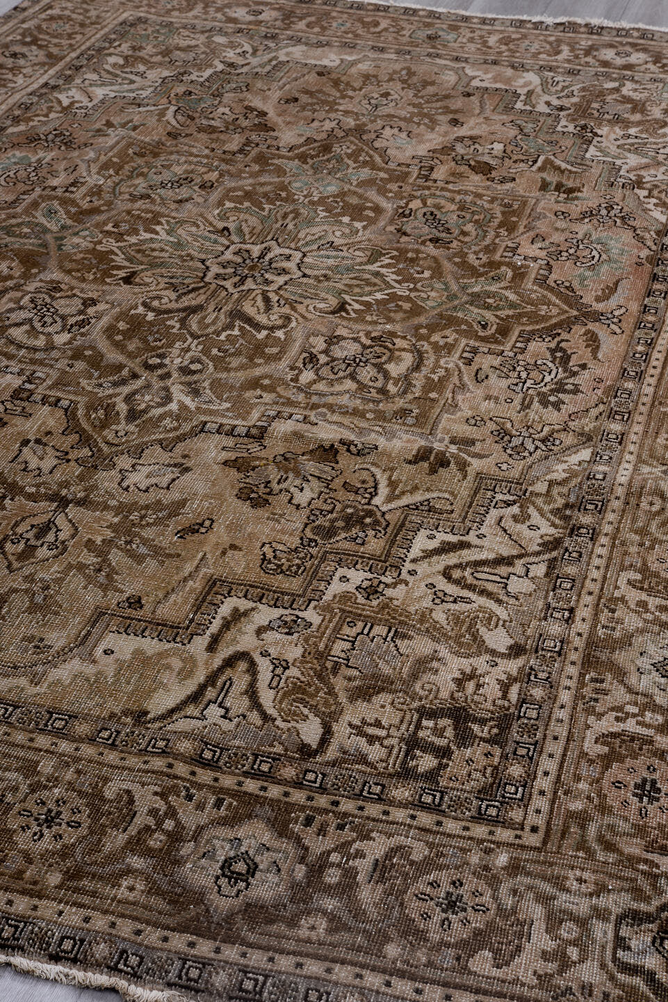6' x 9' one-of-a-kind handmade antique Heriz medium size rug. Color palette: taupe, beige, brown, ivory, pale blue, charcoal