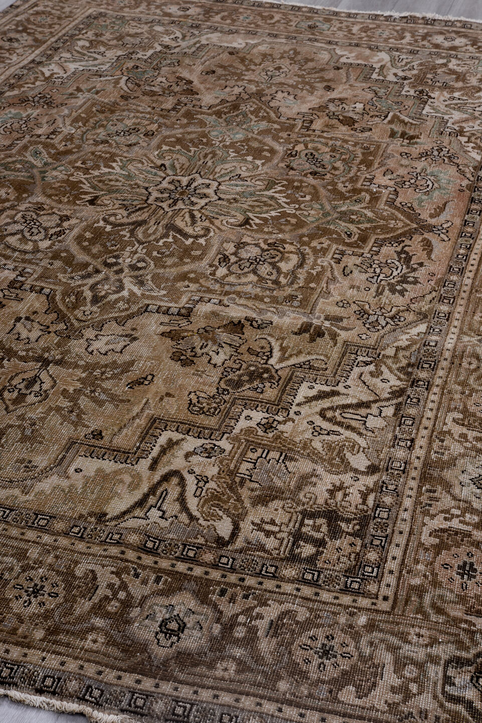 6' x 9' one-of-a-kind handmade antique Heriz medium size rug. Color palette: taupe, beige, brown, ivory, pale blue, charcoal