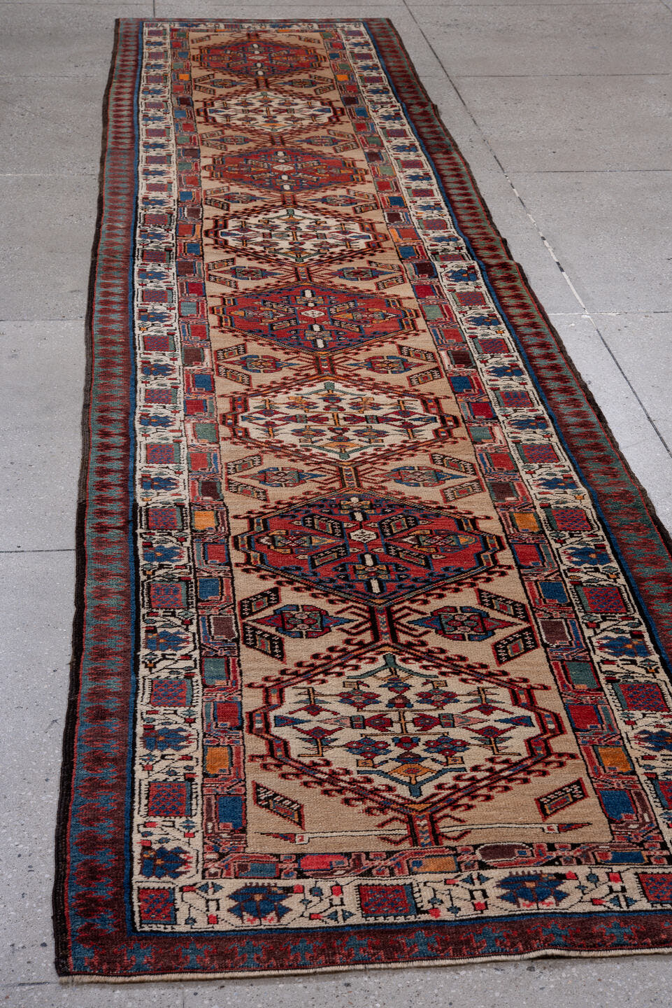 3' x 15' one-of-a-kind handmade antique Sarab runner rug. Color palette: ivory, rust, indigo, crimson, navy, camel, blue