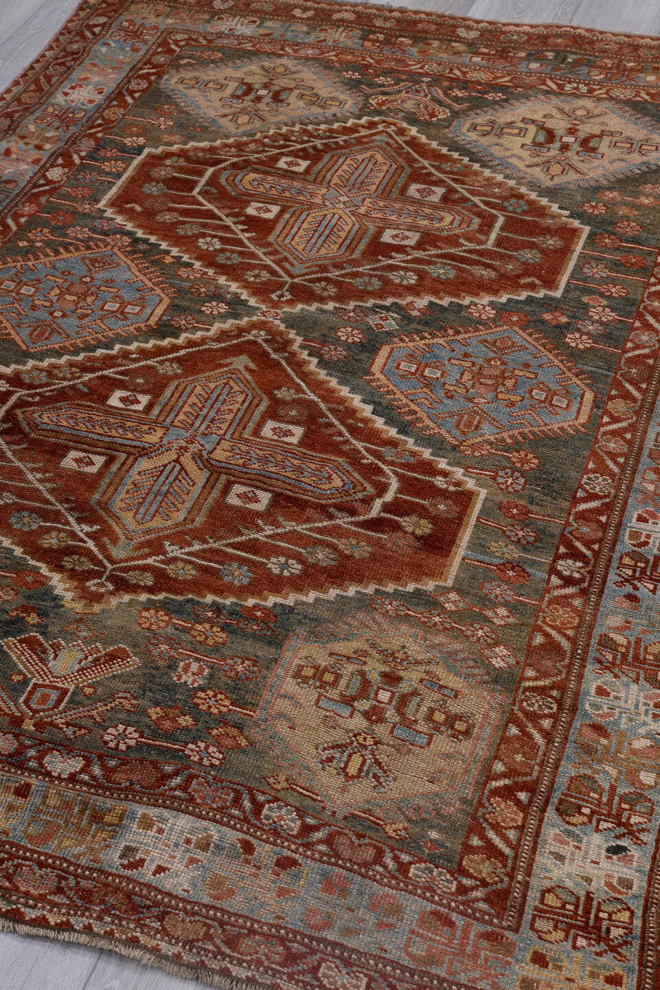 4' x 6' one-of-a-kind handmade antique Baktiary small size rug. Color palette: rust, ivory, sky blue, charcoal, brick, taupe