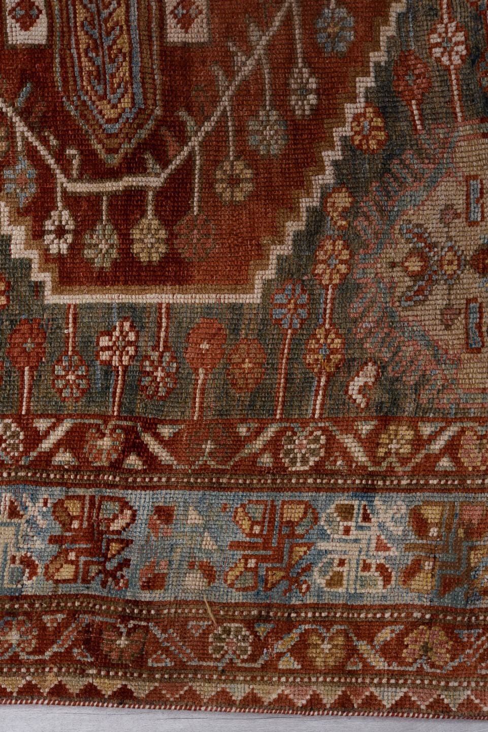 4' x 6' one-of-a-kind handmade antique Baktiary small size rug. Color palette: rust, ivory, sky blue, charcoal, brick, taupe