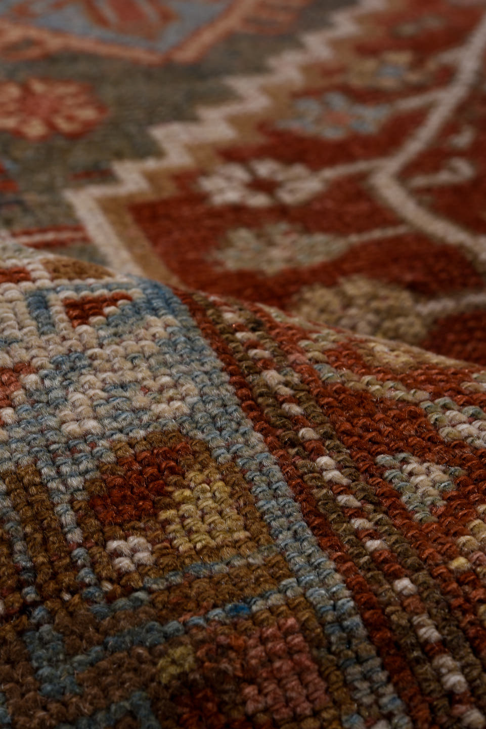 4' x 6' one-of-a-kind handmade antique Baktiary small size rug. Color palette: rust, ivory, sky blue, charcoal, brick, taupe
