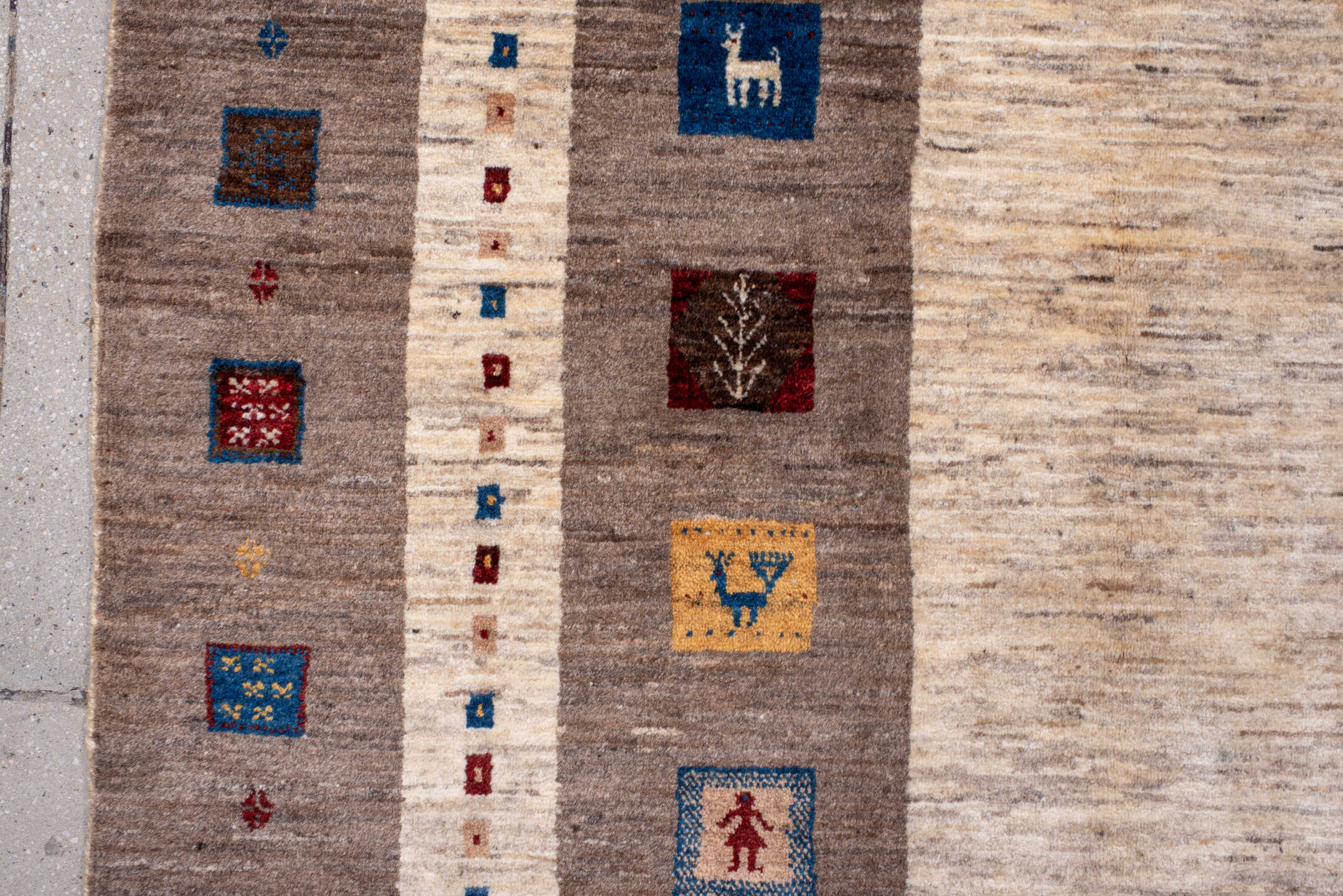 7' x 9' one-of-a-kind handmade vintage Gabbe rug. Color palette: ivory, taupe, brown, indigo, burgundy, gold, camel, beige