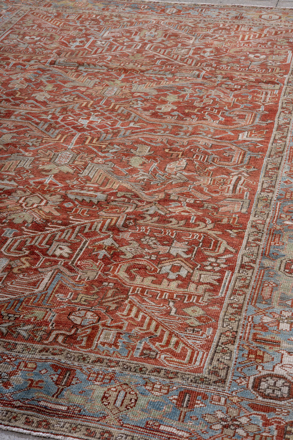 7' x 10' one-of-a-kind handmade vintage Heriz large size rug. Color palette: rust, sky blue, ivory, taupe, sage, burgundy