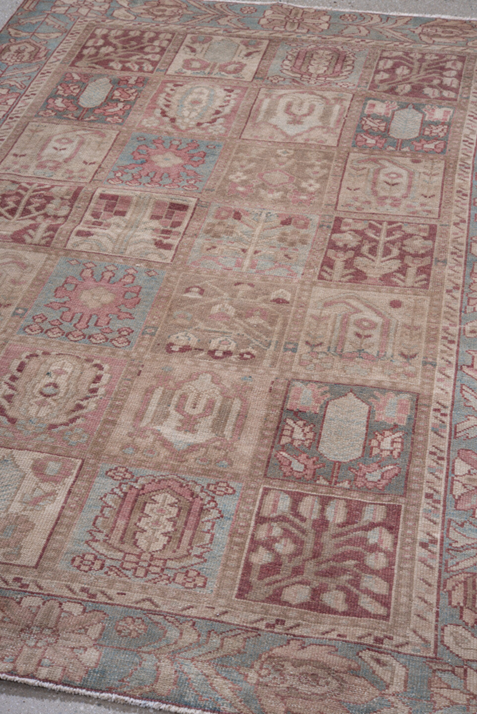 4' x 6' one-of-a-kind handmade antique Baktiary small size rug. Color palette: ivory, sky blue, rose, taupe, dusty pink