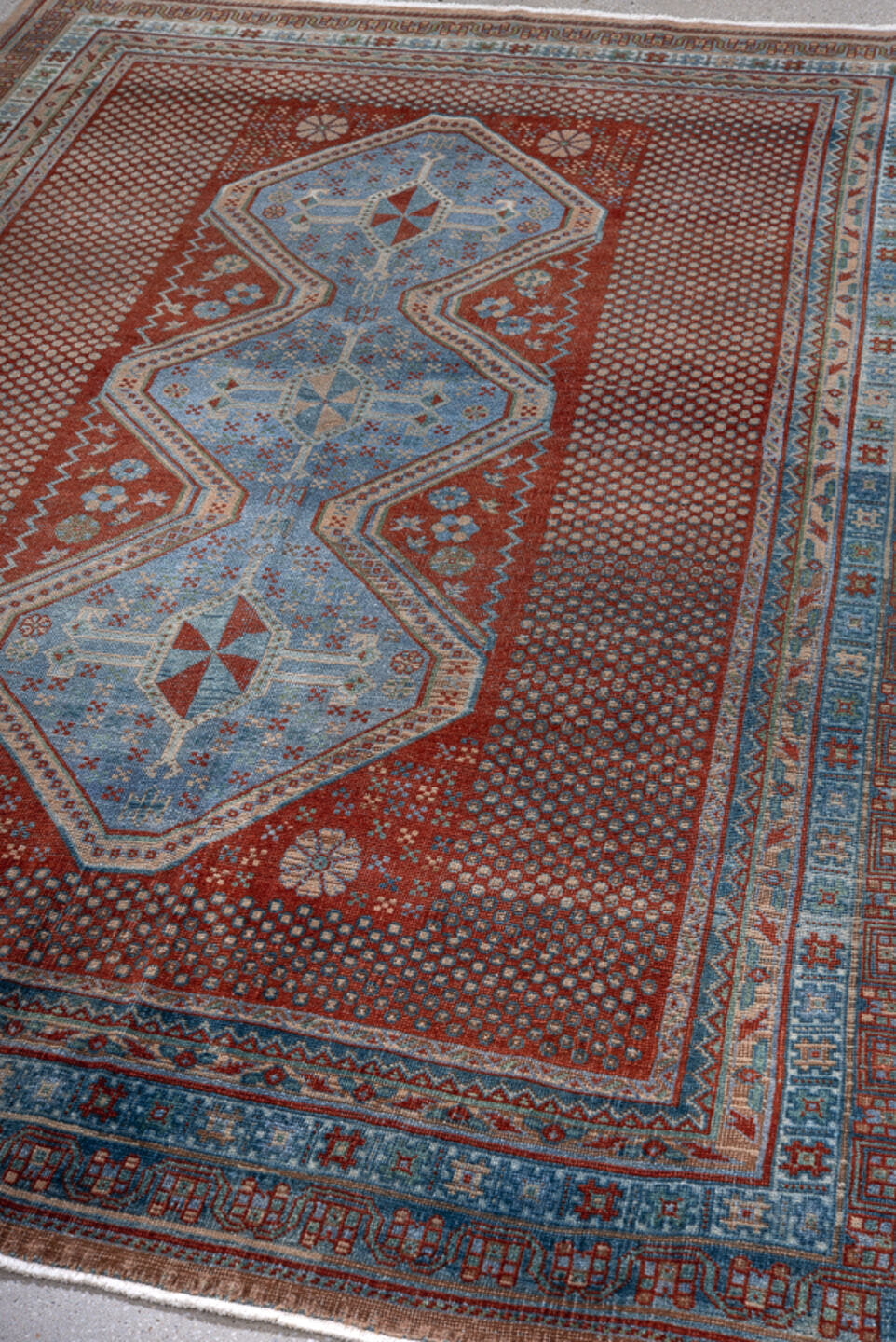 5' x 7' one-of-a-kind handmade antique Afshar rug. Color palette: rust, sky blue, ivory, slate, brick, camel, terracotta