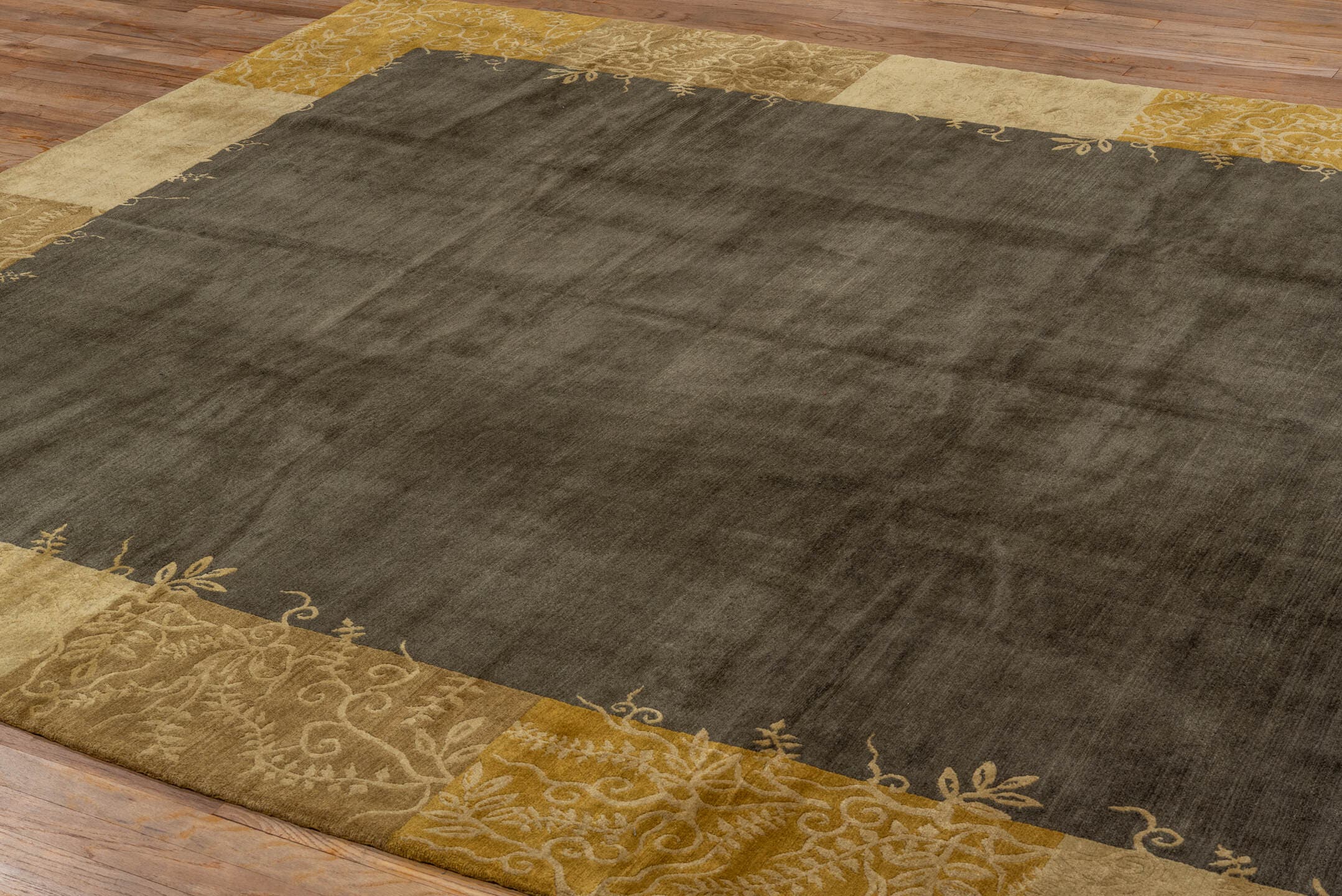 8' x 10' one-of-a-kind handmade vintage Tibetan large size rug. Color palette: charcoal, camel, gold, taupe, brown, ivory