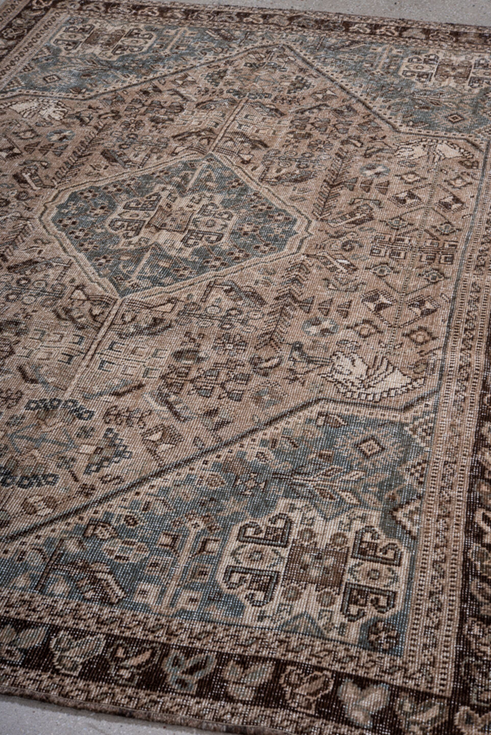 5' x 7' one-of-a-kind handmade vintage Shiraz rug. Color palette: black, blue, brown, charcoal, dim gray, gray, light gray