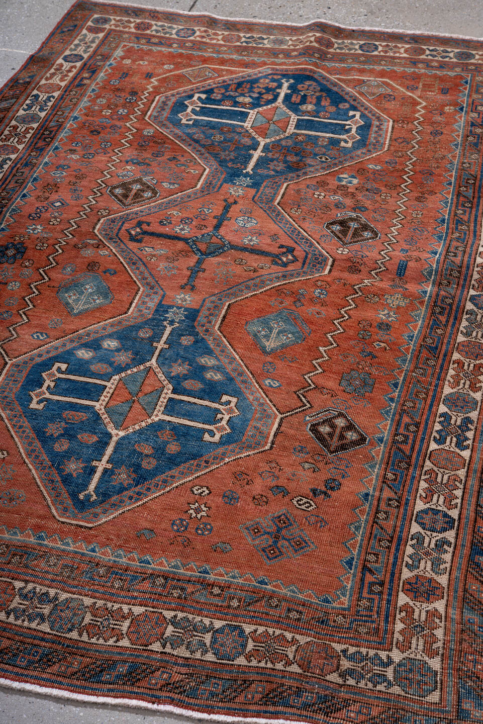 4' x 6' one-of-a-kind handmade antique Afshar small size rug. Color palette: terra cotta, indigo, ivory, rust, slate, camel