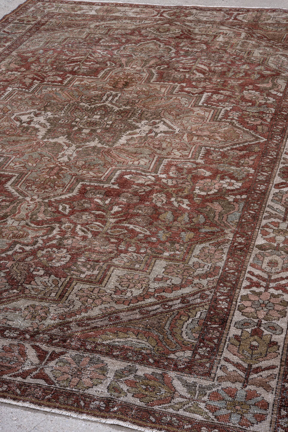 7' x 10' one-of-a-kind handmade antique Baktiary large size rug. Color palette: rust, ivory, taupe, sage, rose, brown, olive