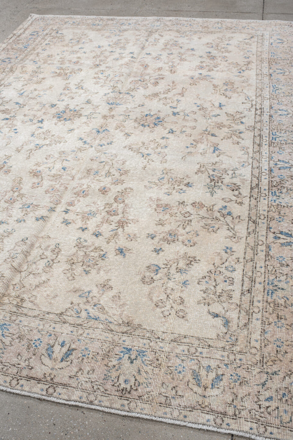 6' x 9' one-of-a-kind handmade antique Sparta medium size rug. Color palette: ivory, beige, sky blue, taupe, cream