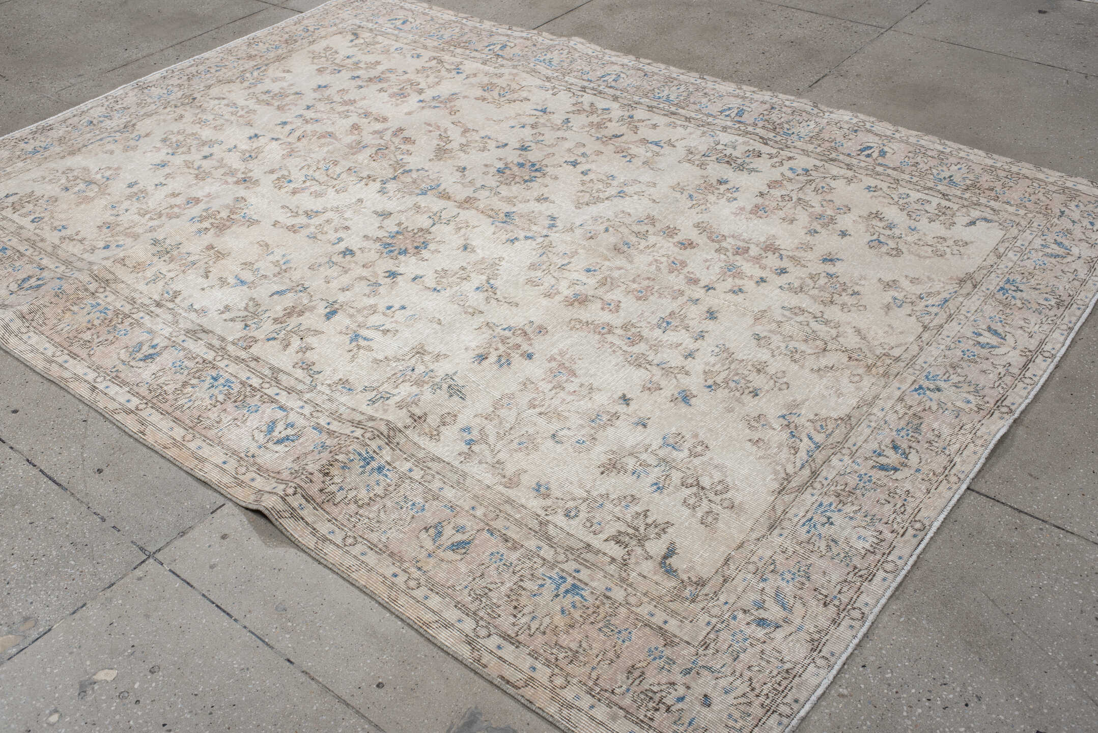 6' x 9' one-of-a-kind handmade antique Sparta medium size rug. Color palette: ivory, beige, sky blue, taupe, cream