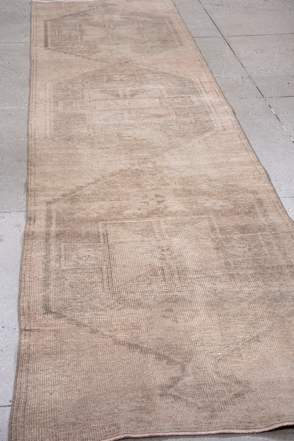 3' x 12' one-of-a-kind handmade vintage Anatol runner rug. Color palette: brown, gray, light gray, off-white, pink, snow