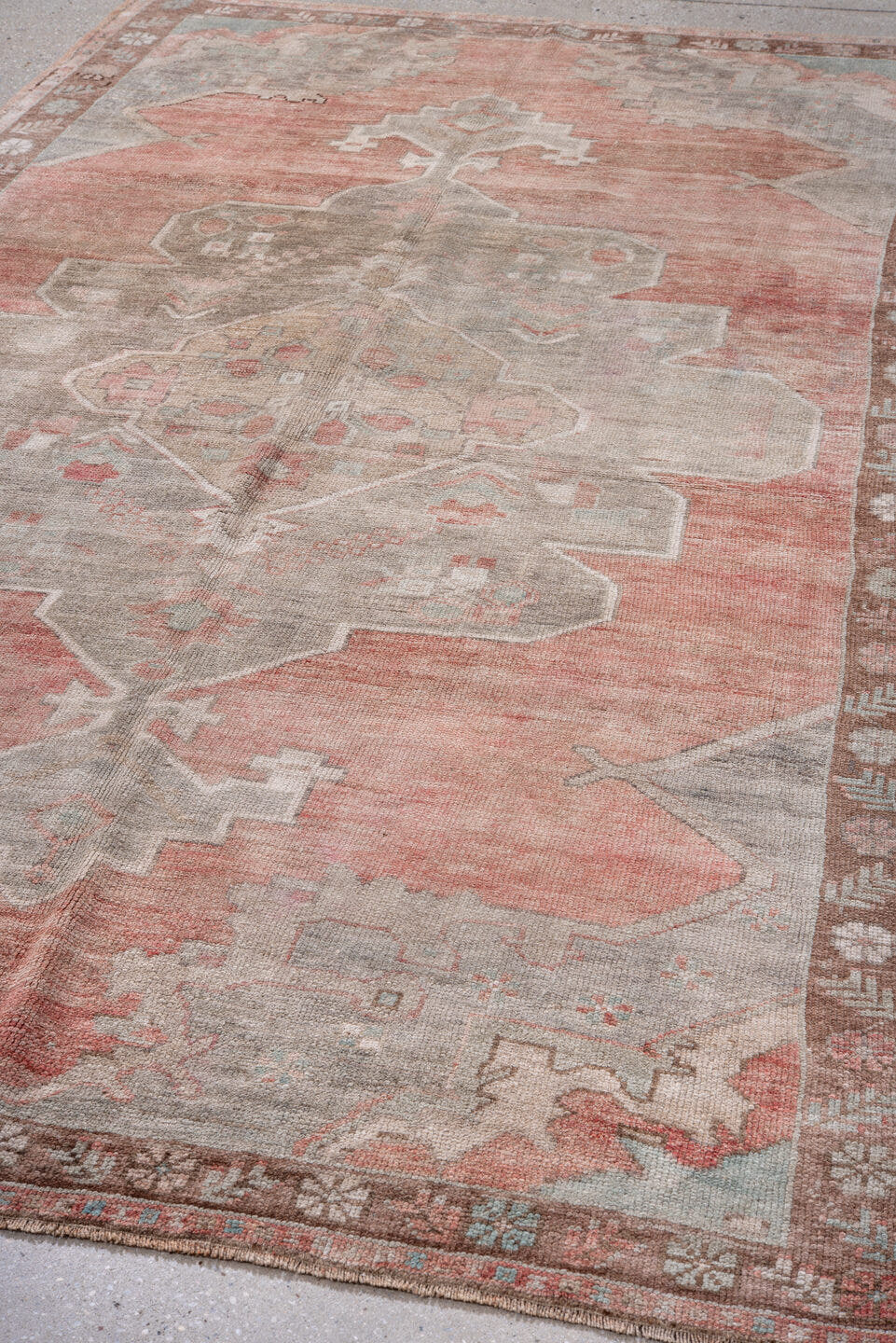 5' x 9' one-of-a-kind handmade antique Oushak medium size rug. Color palette: coral, taupe, ivory, rose, beige, soft gray