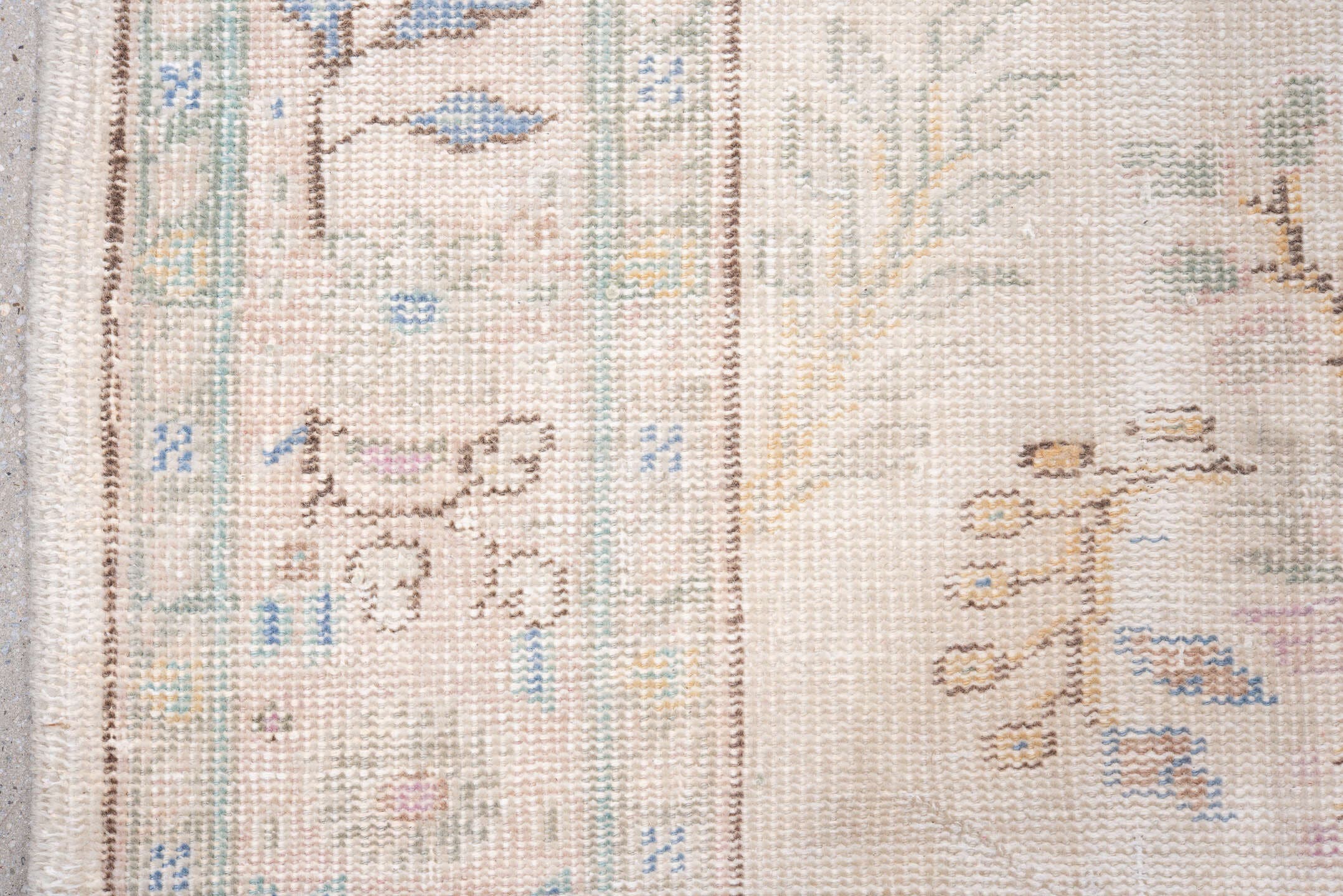 7' x 9' one-of-a-kind handmade antique Sparta rug. Color palette: ivory, blush, pale blue, sand, taupe, sage, peach, pink