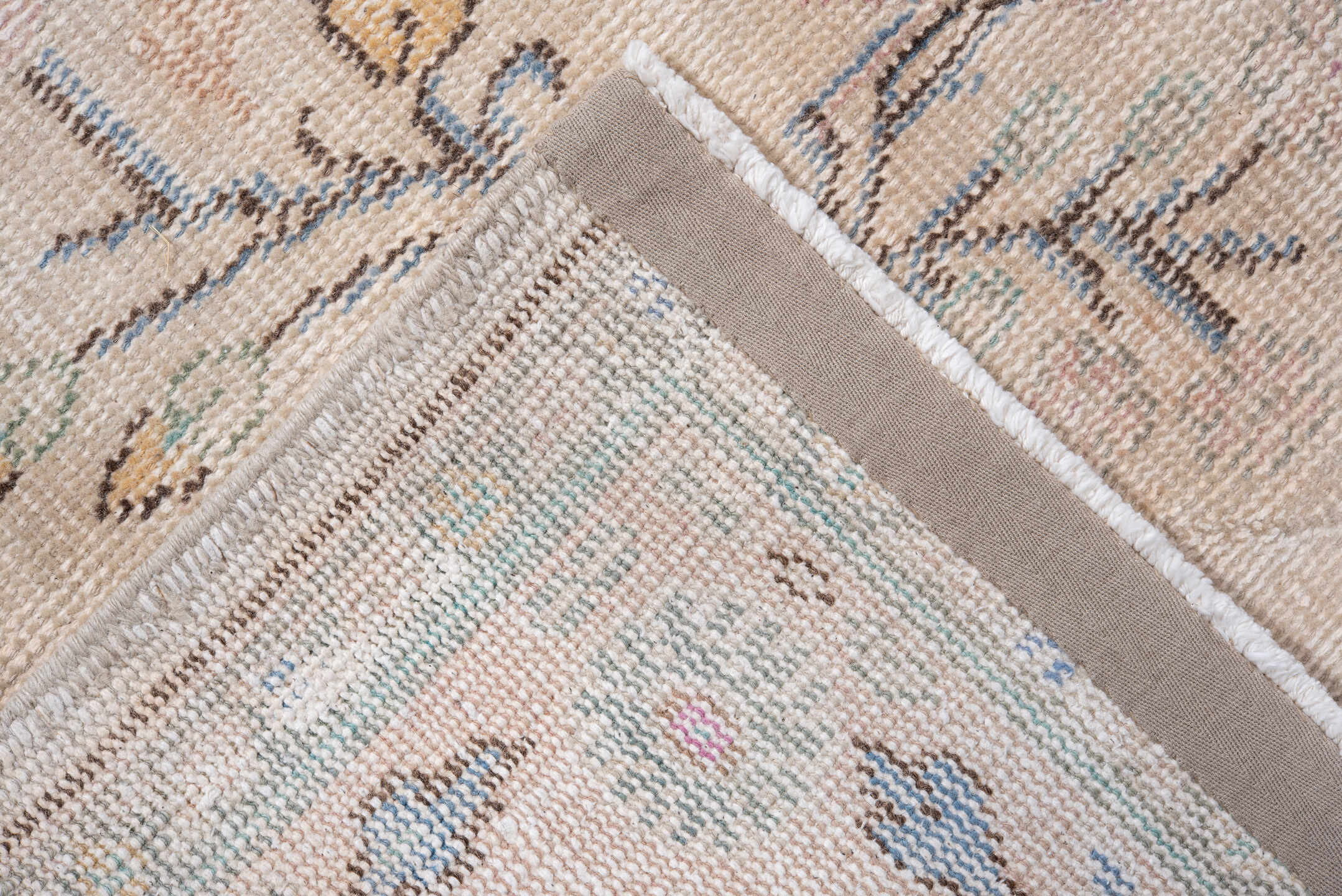 7' x 9' one-of-a-kind handmade antique Sparta rug. Color palette: ivory, blush, pale blue, sand, taupe, sage, peach, pink