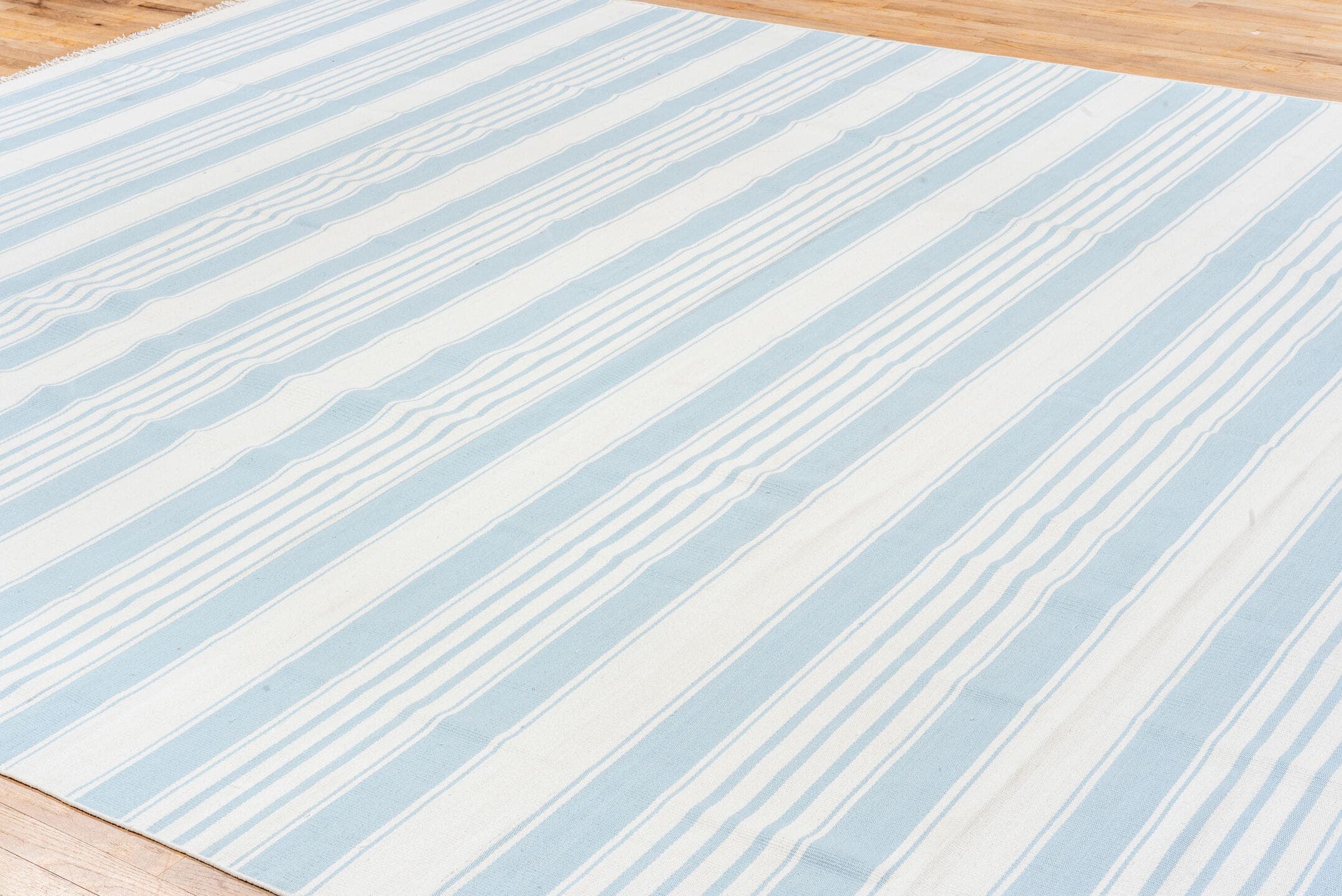 7' x 9' one-of-a-kind handmade antique Sparta rug. Color palette: ivory, blush, pale blue, sand, taupe, sage, peach, pink