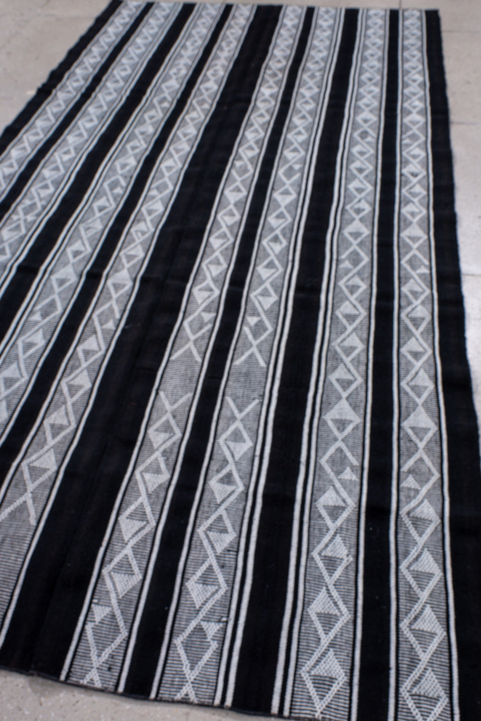 5' x 11' one-of-a-kind handmade vintage Flatweave rug. Color palette: black, blue, charcoal, dark gray, gray, lavender