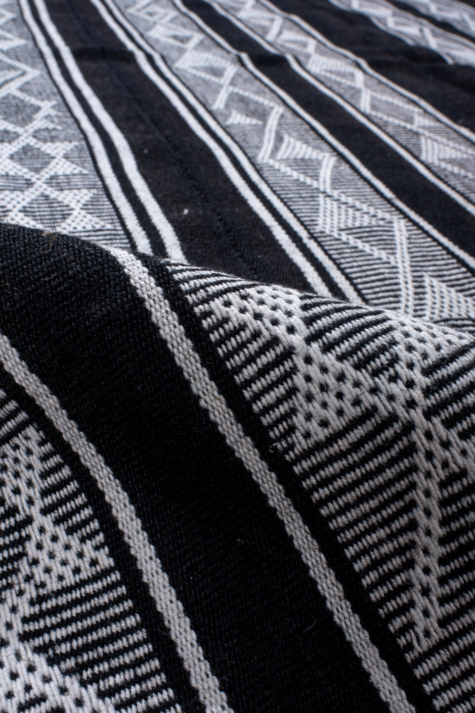 5' x 11' one-of-a-kind handmade vintage Flatweave rug. Color palette: black, blue, charcoal, dark gray, gray, lavender
