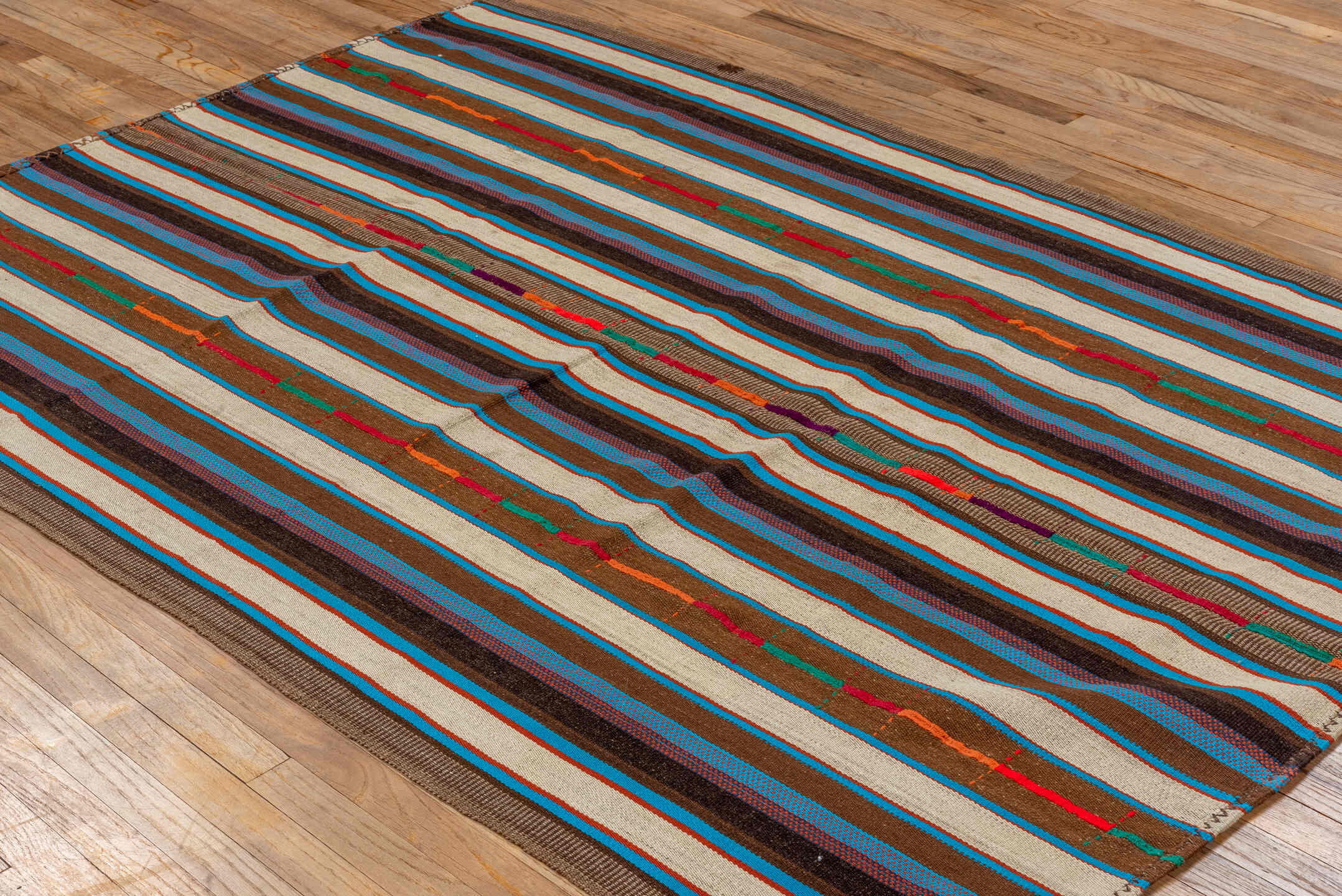 5' x 7' one-of-a-kind handmade vintage Kilim rug. Color palette: ivory, brown, turquoise, charcoal, taupe, rust, crimson