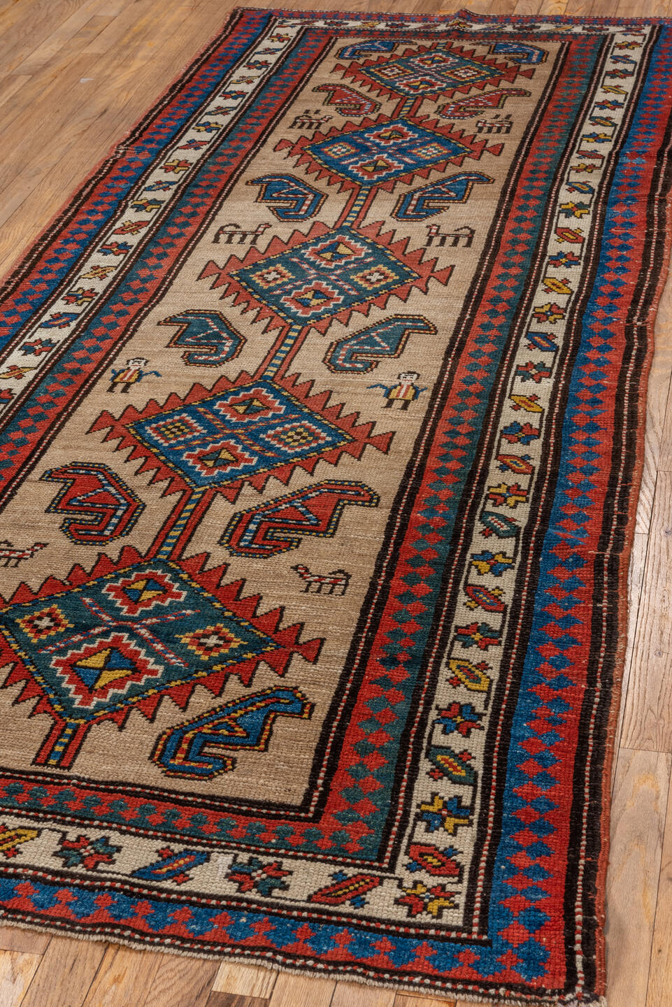 3' x 9' one-of-a-kind handmade antique Sarab runner rug. Color palette: ivory, rust, indigo, blue, brick, gold, charcoal