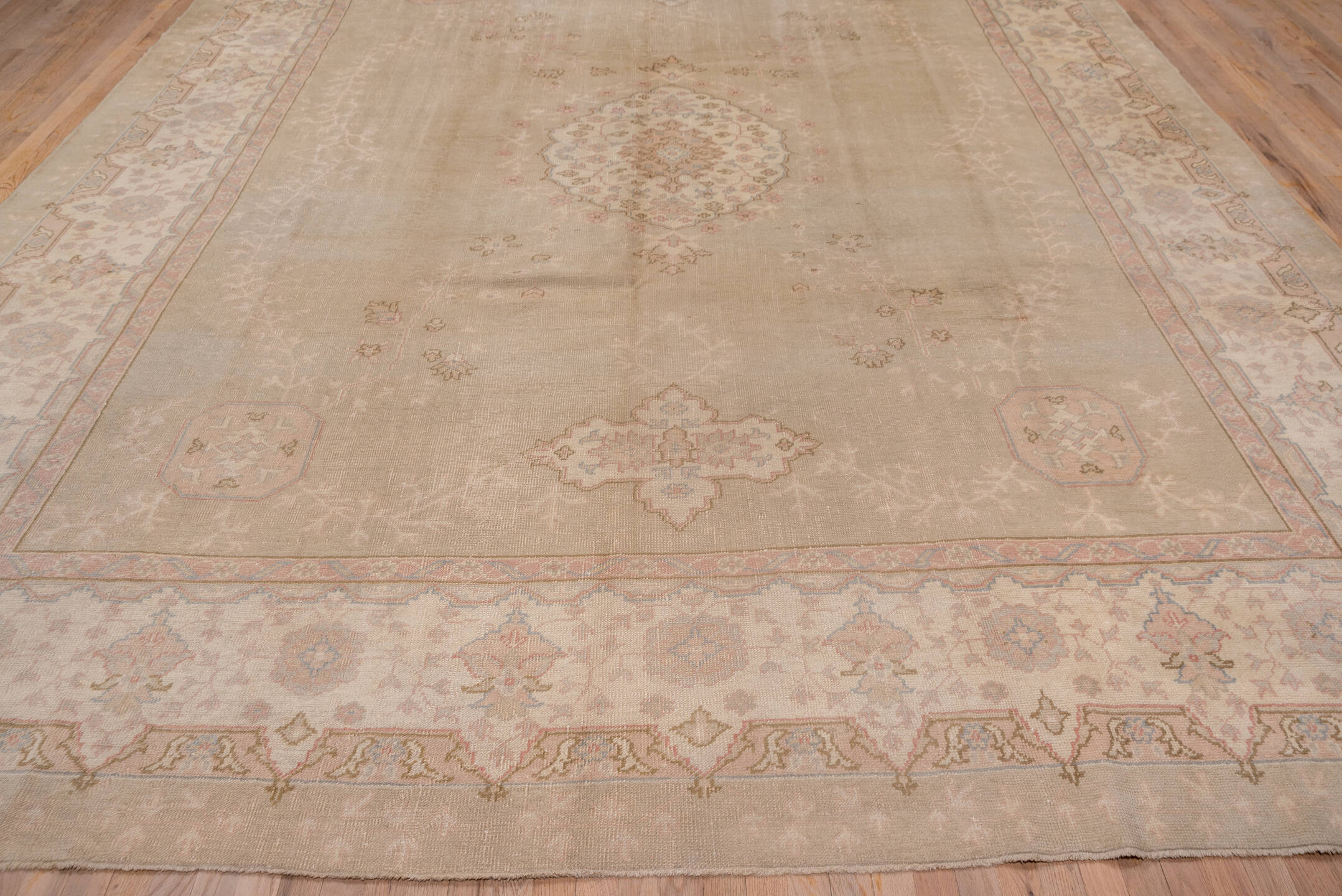 11' x 14' one-of-a-kind handmade antique Oushak oversize rug. Color palette: taupe, ivory, blush, pale blue, beige, sand