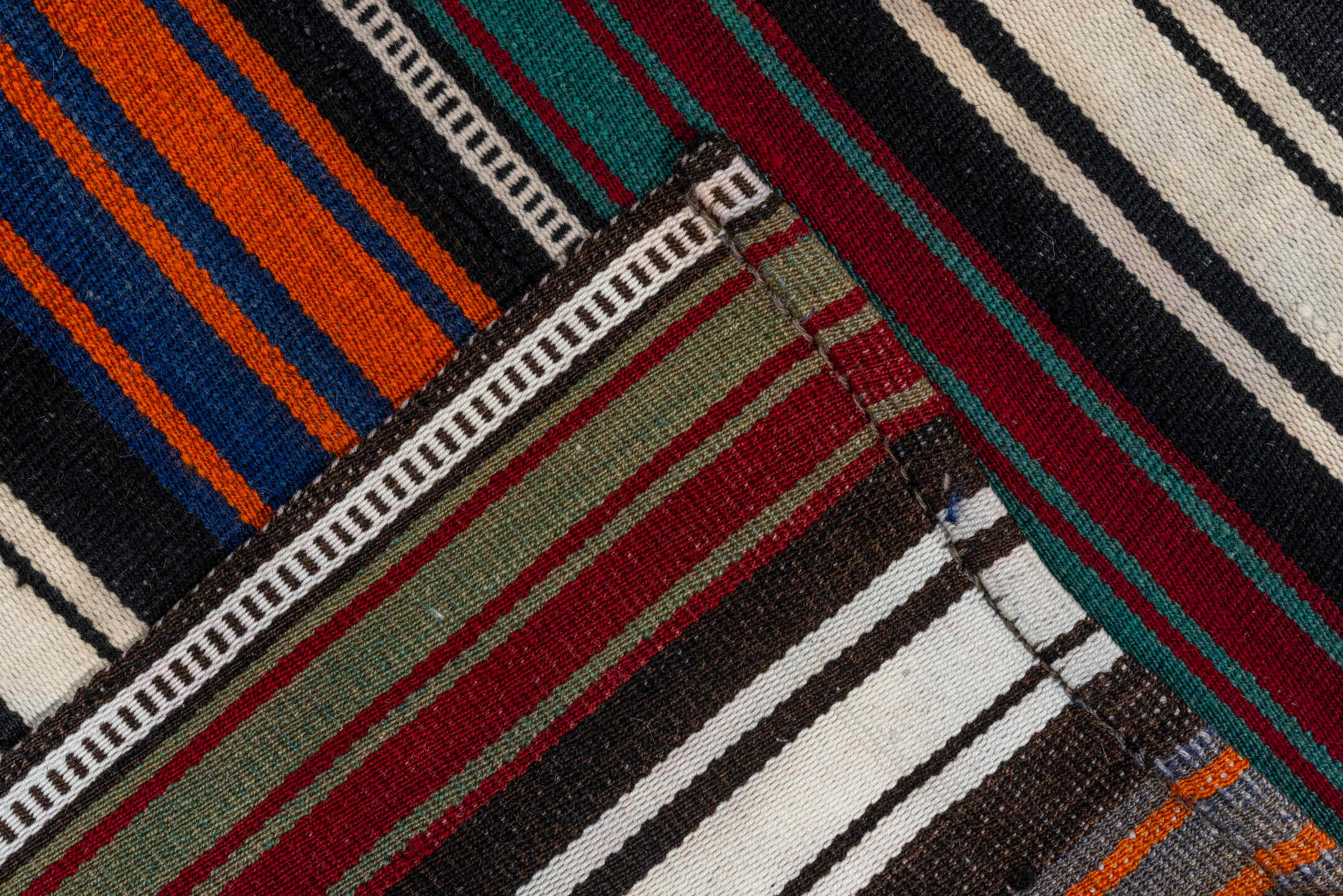 5' x 9' one-of-a-kind handmade vintage Flatweave medium size rug. Color palette: ivory, orange, black, navy, burgundy, teal