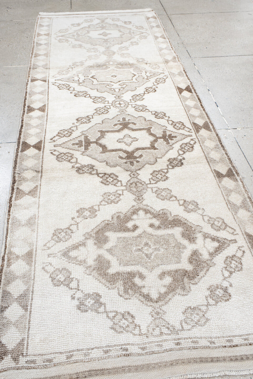 3' x 11' one-of-a-kind handmade vintage Kars runner rug. Color palette: ivory, taupe, camel, beige, brown, gray