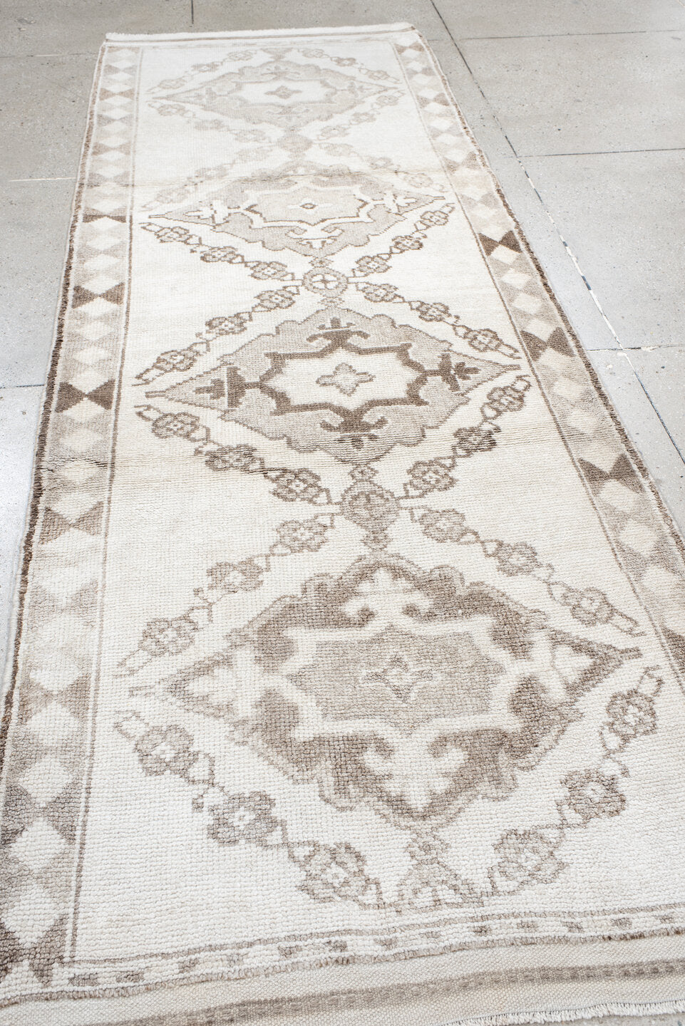 3' x 11' one-of-a-kind handmade vintage Kars runner rug. Color palette: ivory, taupe, camel, beige, brown, gray